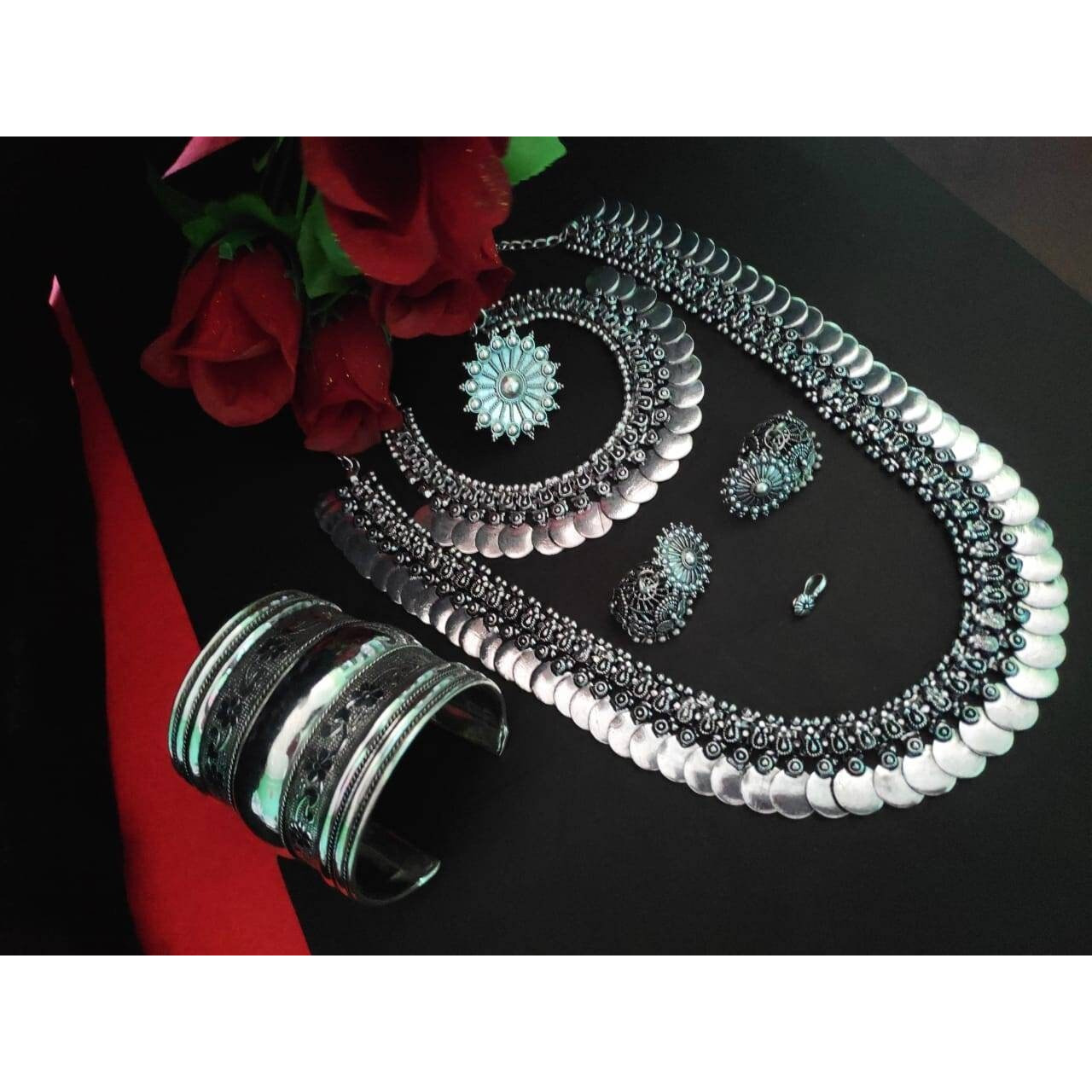 Add charm and Charisma to your beautiful personality with this exquisitely designed and handcrafted German Silver and oxidised necklace and earrings combo set pair it with any casual semi formal or informal attire and gather compliments for unique and classy choice ideal wear for both casual and dressy occasions