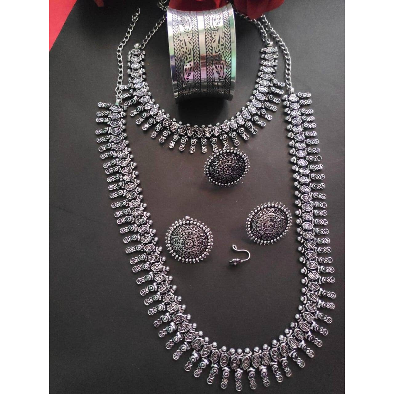 Add charm and Charisma to your beautiful personality with this exquisitely designed and handcrafted German Silver and oxidised necklace and earrings combo set pair it with any casual semi formal or informal attire and gather compliments for unique and classy choice ideal wear for both casual and dressy occasions