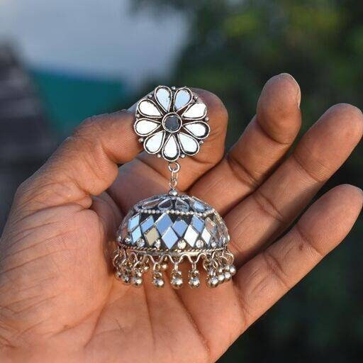 Ethnic wear has always been the first choice of Indian women and Vastrabhushan has taken greatcare to design elegant and beautiful Indian jewelry. The Oxidised Choker set with jhumka earringscan be matched with any saree or salwar suit of your choice. Whether you like to wear it for afestival or a wedding, you are surely going to win over hearts with this brilliant oxidized jewelry set.Its minimalist style and premium quality make it a great addition to your brass jewelry collection.Jewelry care