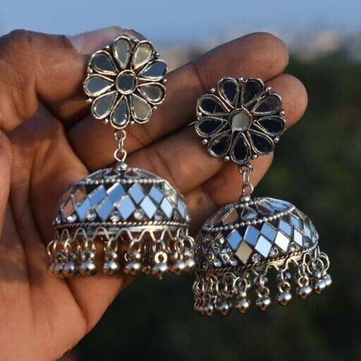 Ethnic wear has always been the first choice of Indian women and Vastrabhushan has taken greatcare to design elegant and beautiful Indian jewelry. The Oxidised Choker set with jhumka earringscan be matched with any saree or salwar suit of your choice. Whether you like to wear it for afestival or a wedding, you are surely going to win over hearts with this brilliant oxidized jewelry set.Its minimalist style and premium quality make it a great addition to your brass jewelry collection.Jewelry care