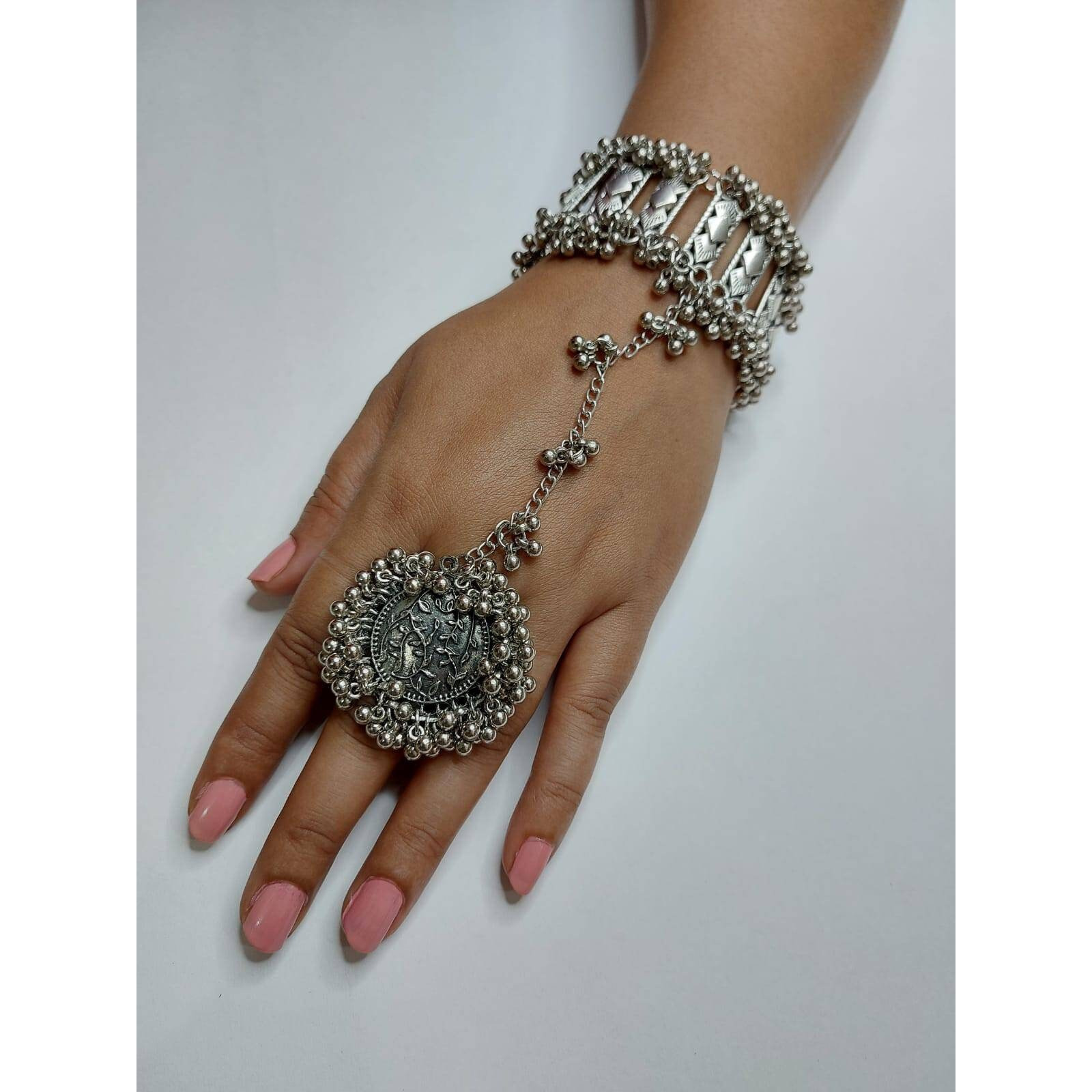 Traditional Rajasthani Silver Kada Bracelet, Broad Silver Kada, Handmade Bracelet, Party Wear Silver Stud Kada, Black Polish KadaBringing you a one-of-a-kind bracelet, a Kada that celebrates an intricate design. Loot compliments with this unique and quirky bracelet everywhere you step in These beautifully ornate antique kadas add a bling to your outfit and are perfect for weddings, anniversaries, and almost every occasion. When paired with casuals, it will create a cool boho look If you love t