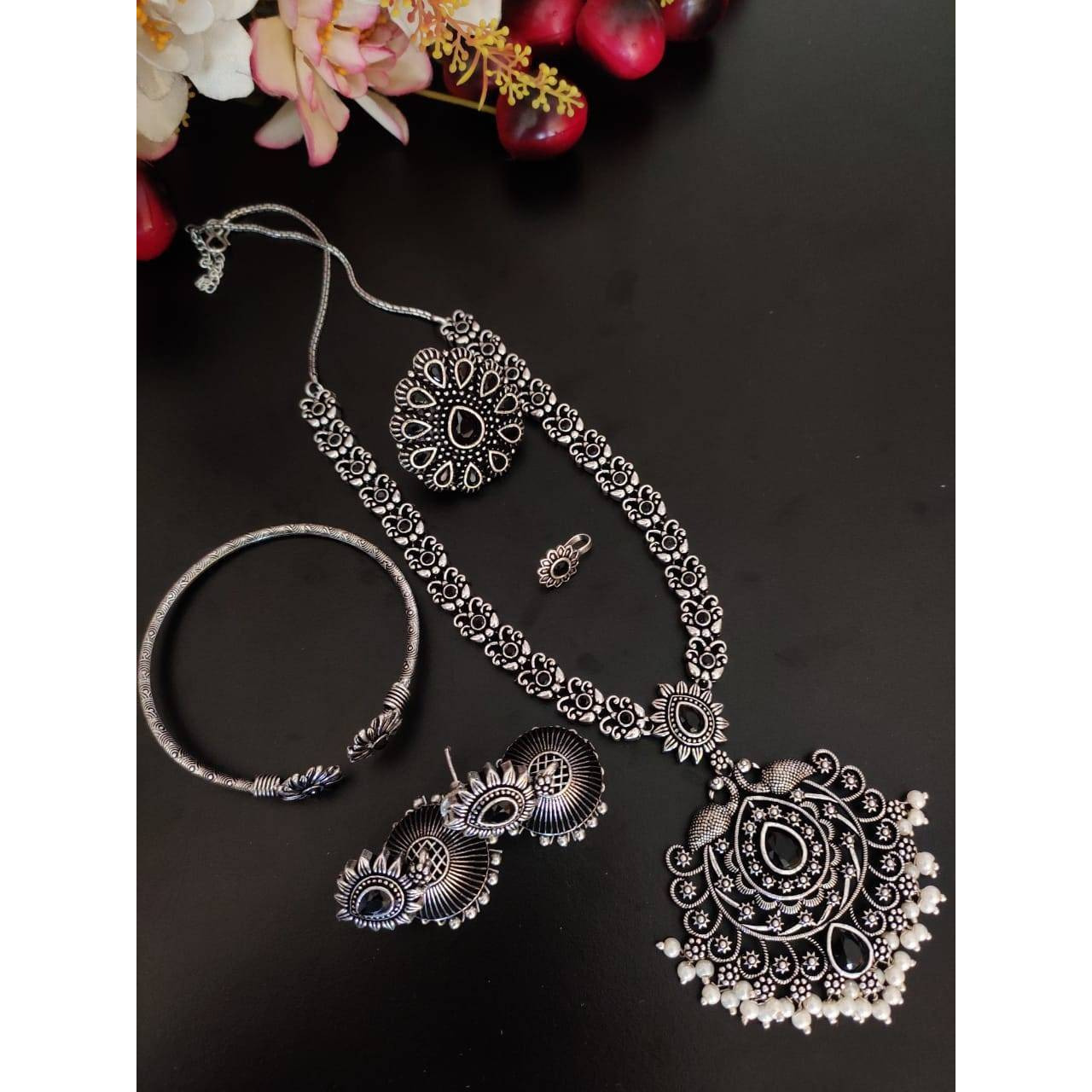 Dramatising the classic hoop style of earrings, is this gorgeous pair of earrings that boasts of striking detail with ghungroo hangings.. Glamorous yet effortless, these hoops are real keepers for souls who are looking for a classic yet versatile piece of jewelry. The kind of jewelry that adds oomph to your casual wear and also matches the edge of your occasion special Indian Wear.