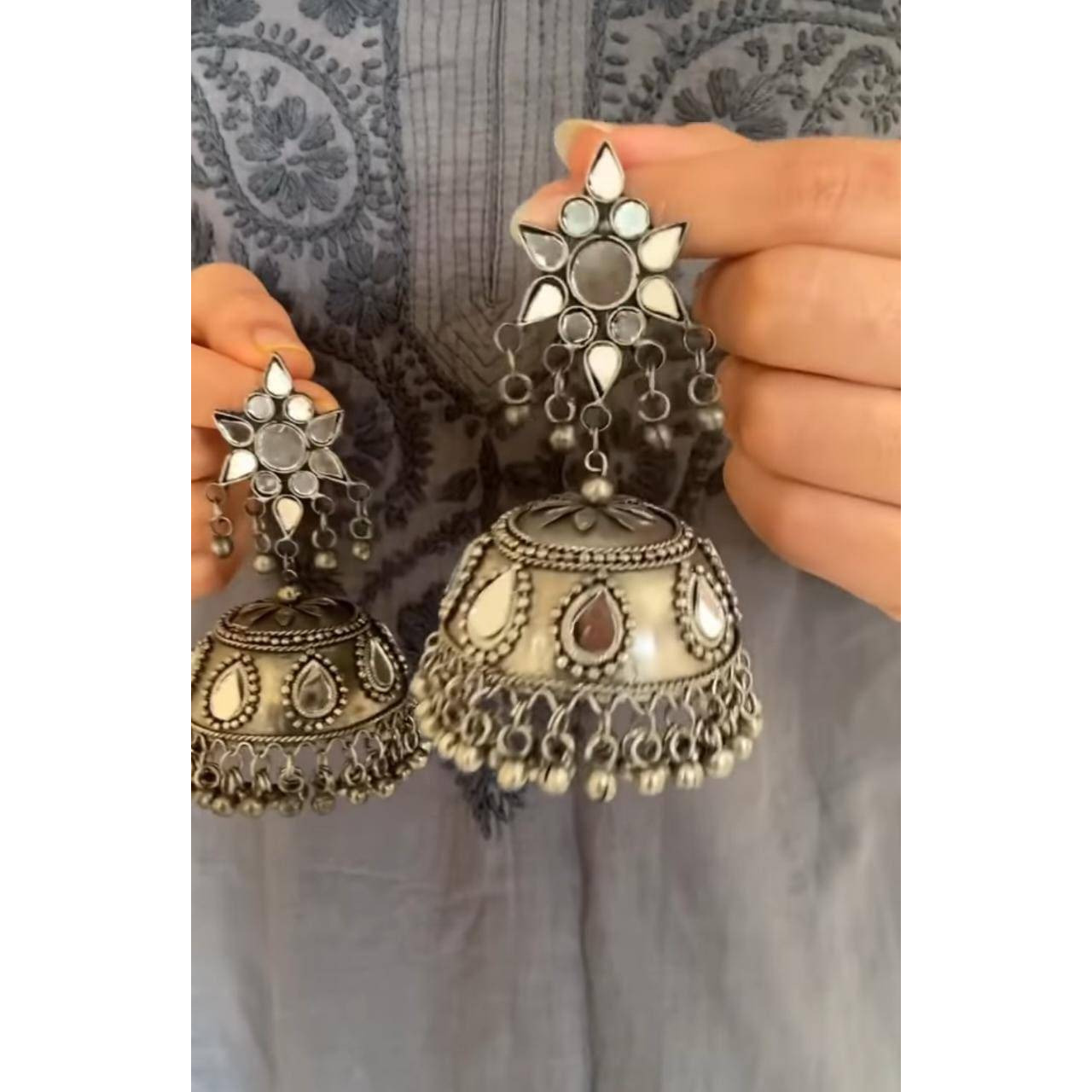 Trendy kettle shape design long earrings with alloy. Simple yet elegant danglers crafted with silver tone German Silver. Modern look which will fit with your whole wardrobe Earring Height 4.1 inch. Total Weight 39 gram. Keep your jewelry in dry, padded box to protect from scratches. Keep away from perfume, water other strong liquid