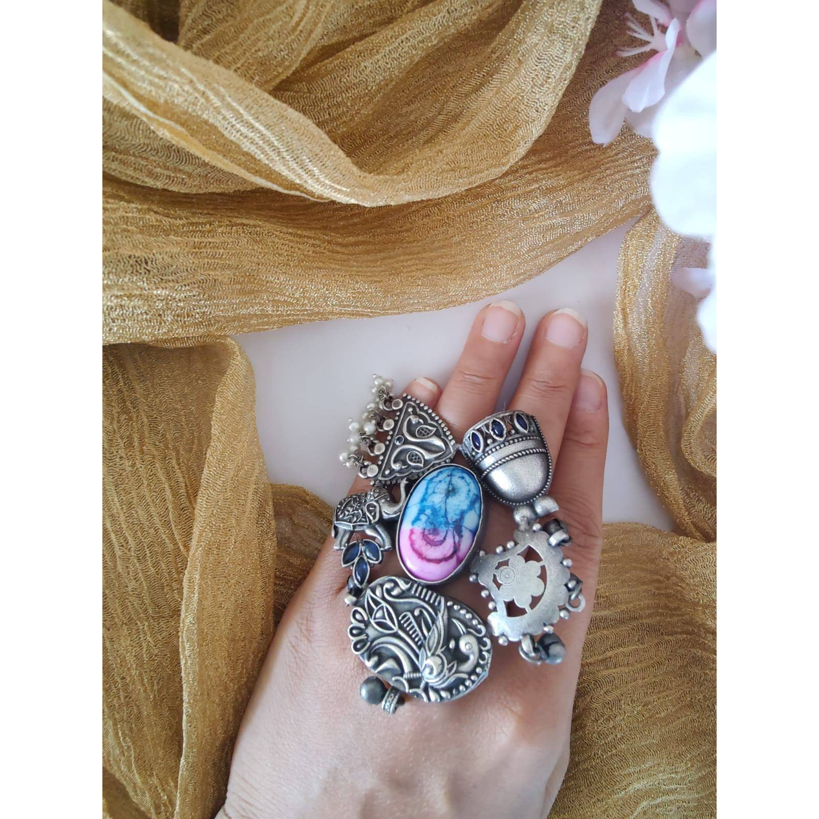 If you were looking for a brilliant ring, the Dual Tone Ring from Vastrabhushan is an excellent choice.The oxidized silver jewelry is a contemporary choice, ideal for modern women. It can be worn onformal as well as casual occasions. Pair it with your Indo-western dresses or ethnic apparel to createa unique look. Want to fascinate others as well with a great ring Gift it to a close friend or relativeand savor the appreciation for a great find.Jewelry care tips Take care to wipe jewelry b