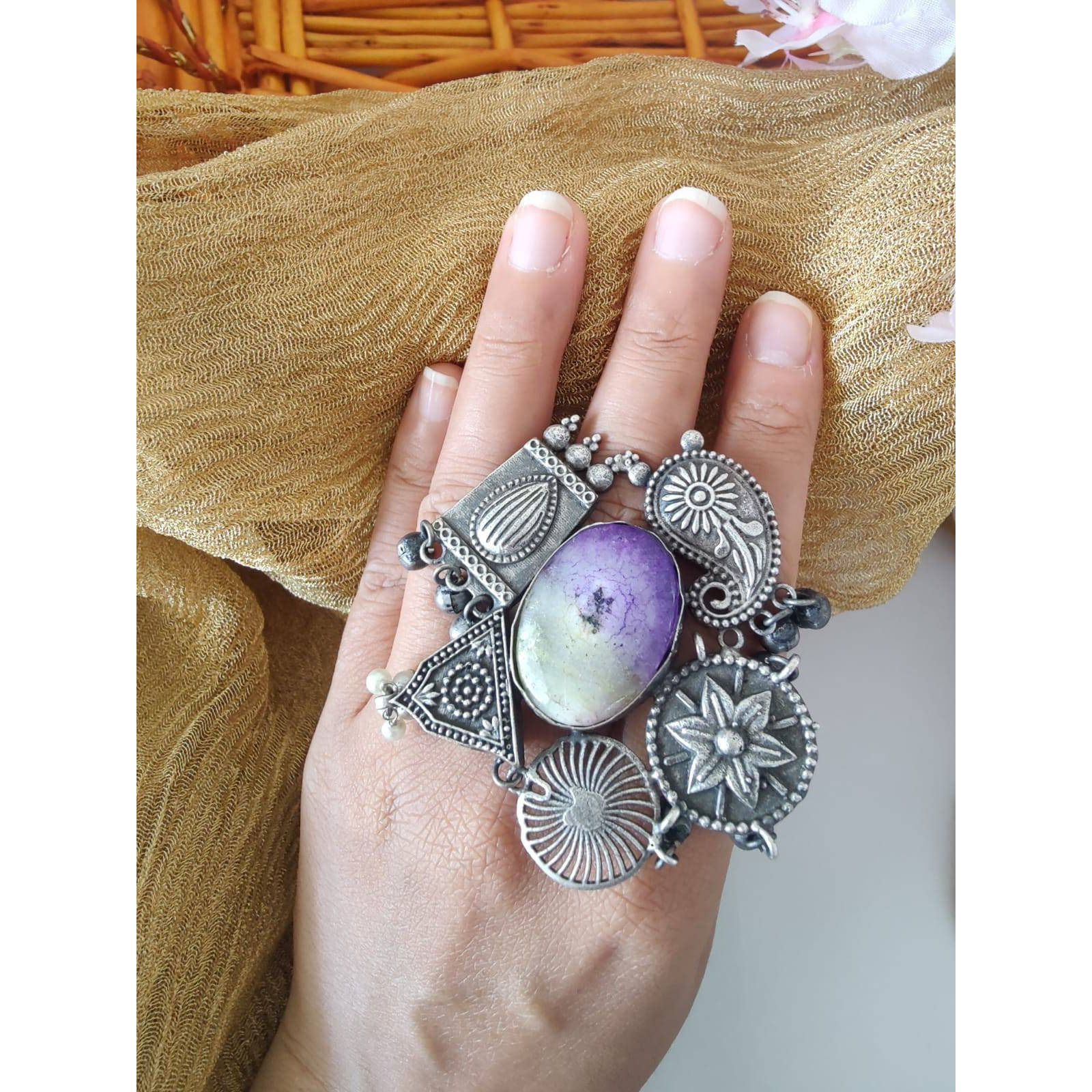 If you were looking for a brilliant ring, the Dual Tone Ring from Vastrabhushan is an excellent choice.The oxidized silver jewelry is a contemporary choice, ideal for modern women. It can be worn onformal as well as casual occasions. Pair it with your Indo-western dresses or ethnic apparel to createa unique look. Want to fascinate others as well with a great ring Gift it to a close friend or relativeand savor the appreciation for a great find.Jewelry care tips Take care to wipe jewelry b