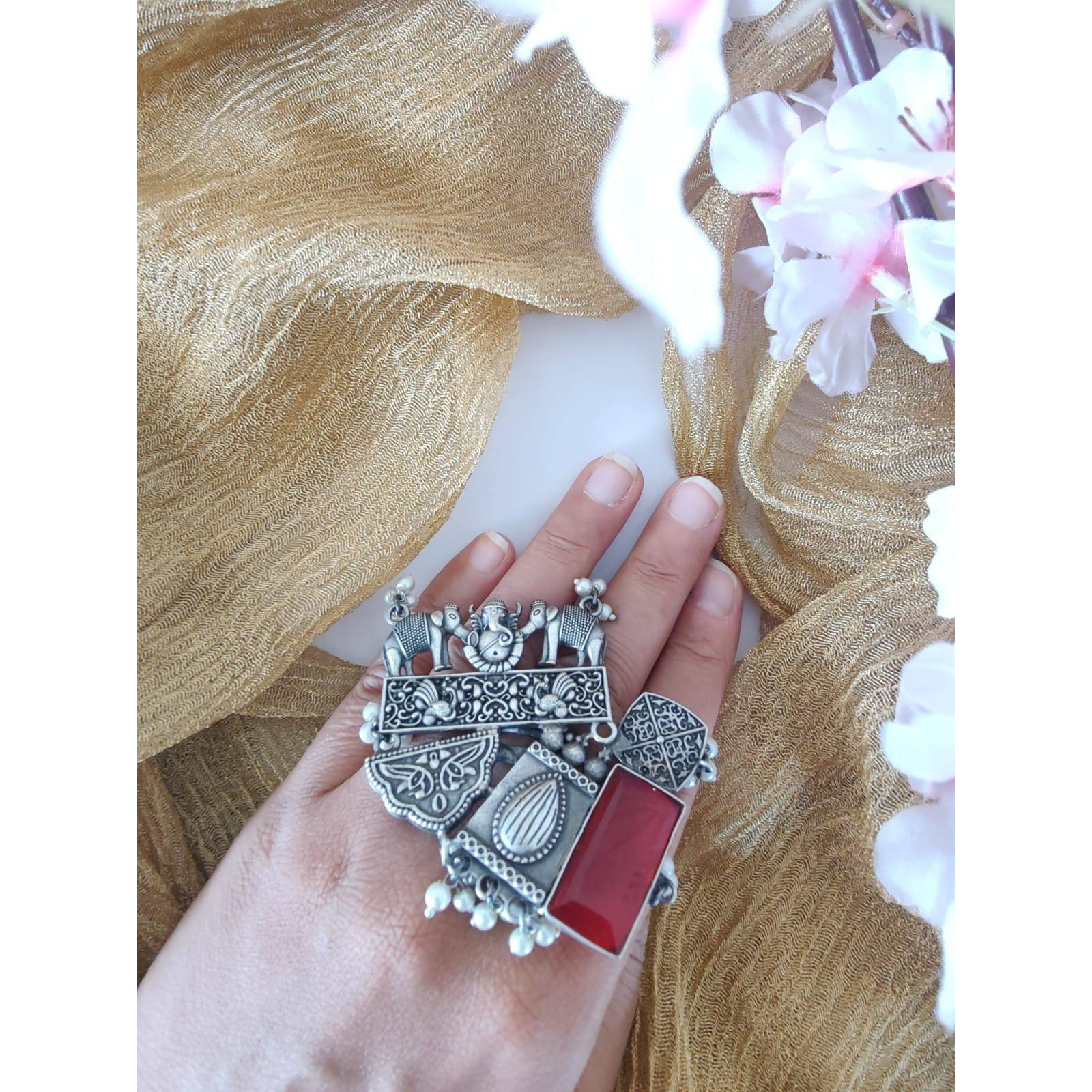 If you were looking for a brilliant ring, the Dual Tone Ring from Vastrabhushan is an excellent choice.The oxidized silver jewelry is a contemporary choice, ideal for modern women. It can be worn onformal as well as casual occasions. Pair it with your Indo-western dresses or ethnic apparel to createa unique look. Want to fascinate others as well with a great ring Gift it to a close friend or relativeand savor the appreciation for a great find.Jewelry care tips Take care to wipe jewelry b