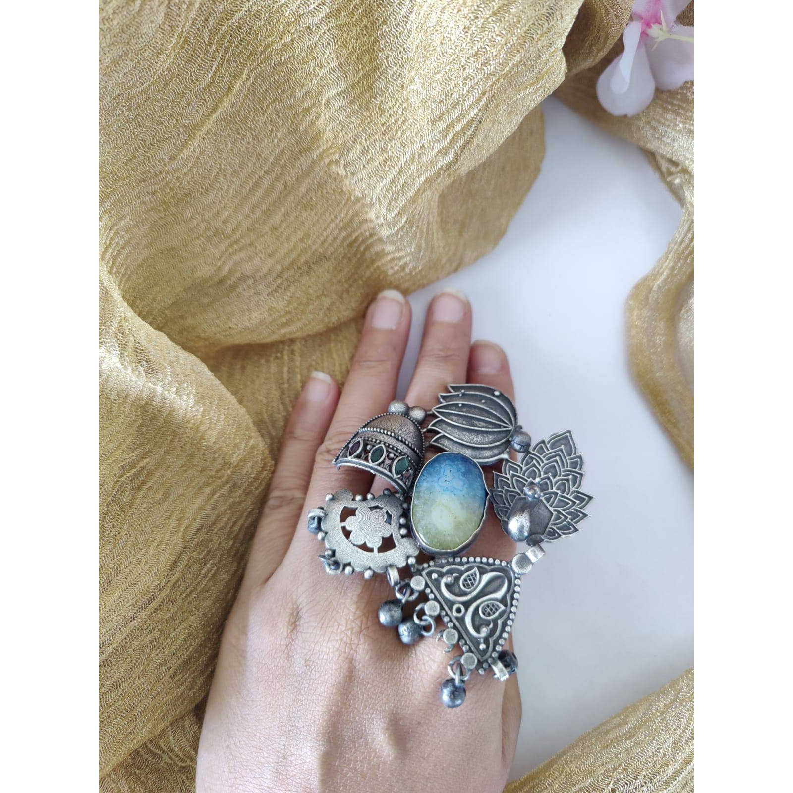 If you were looking for a brilliant ring, the Dual Tone Ring from Vastrabhushan is an excellent choice.The oxidized silver jewelry is a contemporary choice, ideal for modern women. It can be worn onformal as well as casual occasions. Pair it with your Indo-western dresses or ethnic apparel to createa unique look. Want to fascinate others as well with a great ring Gift it to a close friend or relativeand savor the appreciation for a great find.Jewelry care tips Take care to wipe jewelry b