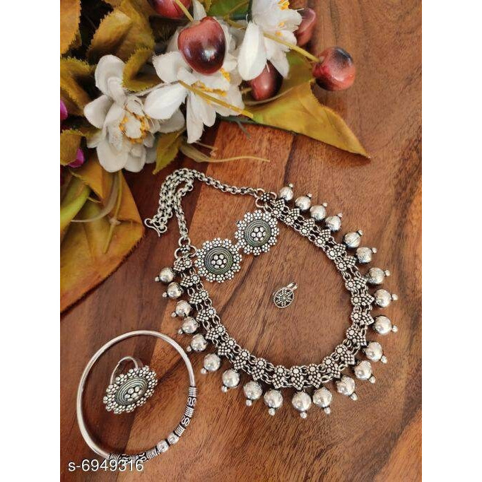This is a long necklace crafted in German silver dual tone plating that falls impressively on your neck. If you are somebody who loves to wear bold pieces of jewellery every time you step out, this necklace will definitely be your go-to. For we are forever looking for pieces that justify occasion and everyday outfits alike. Intricately crafted with a variety of motifs. Our Antique dual tone necklace set adds the finishing touch to your every occasion wear.