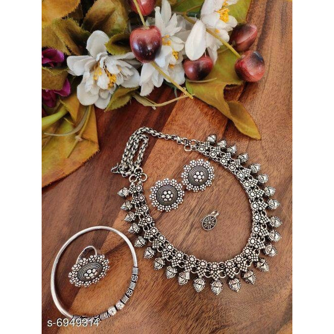 This is a long necklace crafted in German silver dual tone plating that falls impressively on your neck. If you are somebody who loves to wear bold pieces of jewellery every time you step out, this necklace will definitely be your go-to. For we are forever looking for pieces that justify occasion and everyday outfits alike. Intricately crafted with a variety of motifs. Our Antique dual tone necklace set adds the finishing touch to your every occasion wear.