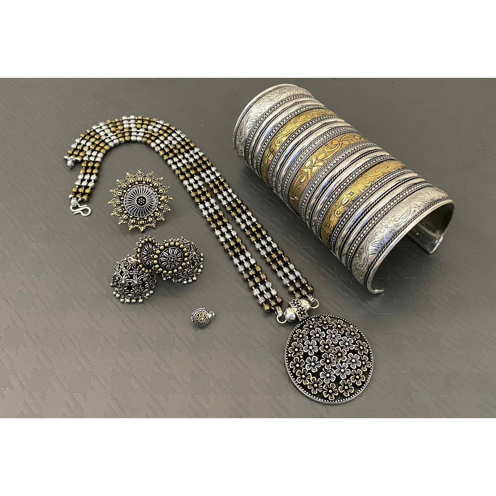 Adorn your beautiful personality with this exquisitely designed and handcrafted necklace in high quality German Silver. Pair it up with any casual,semi formal or formal attire for that traditional yet contemporary look.