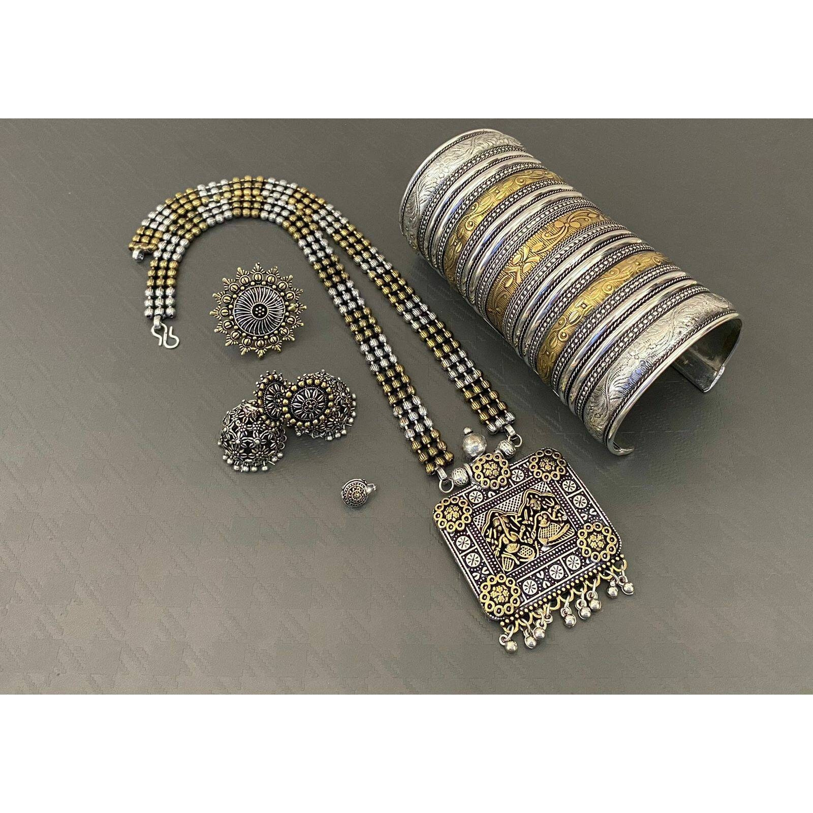 Adorn your beautiful personality with this exquisitely designed and handcrafted necklace in high quality German Silver. Pair it up with any casual,semi formal or formal attire for that traditional yet contemporary look.