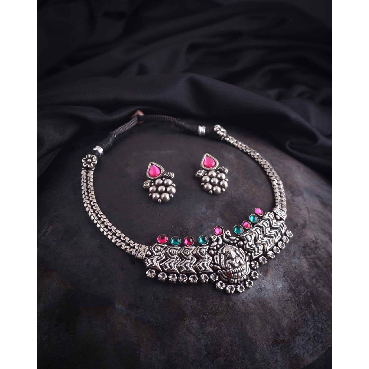 This beautiful set of 6 has a big long Haram necklace with a choker silver necklace, pair of stud earrings, a ring,a Kada , and a nose pin.Grab this beautiful set with any of the ethnic/ Indo western outfit and look unique in the crowdPremium quality set