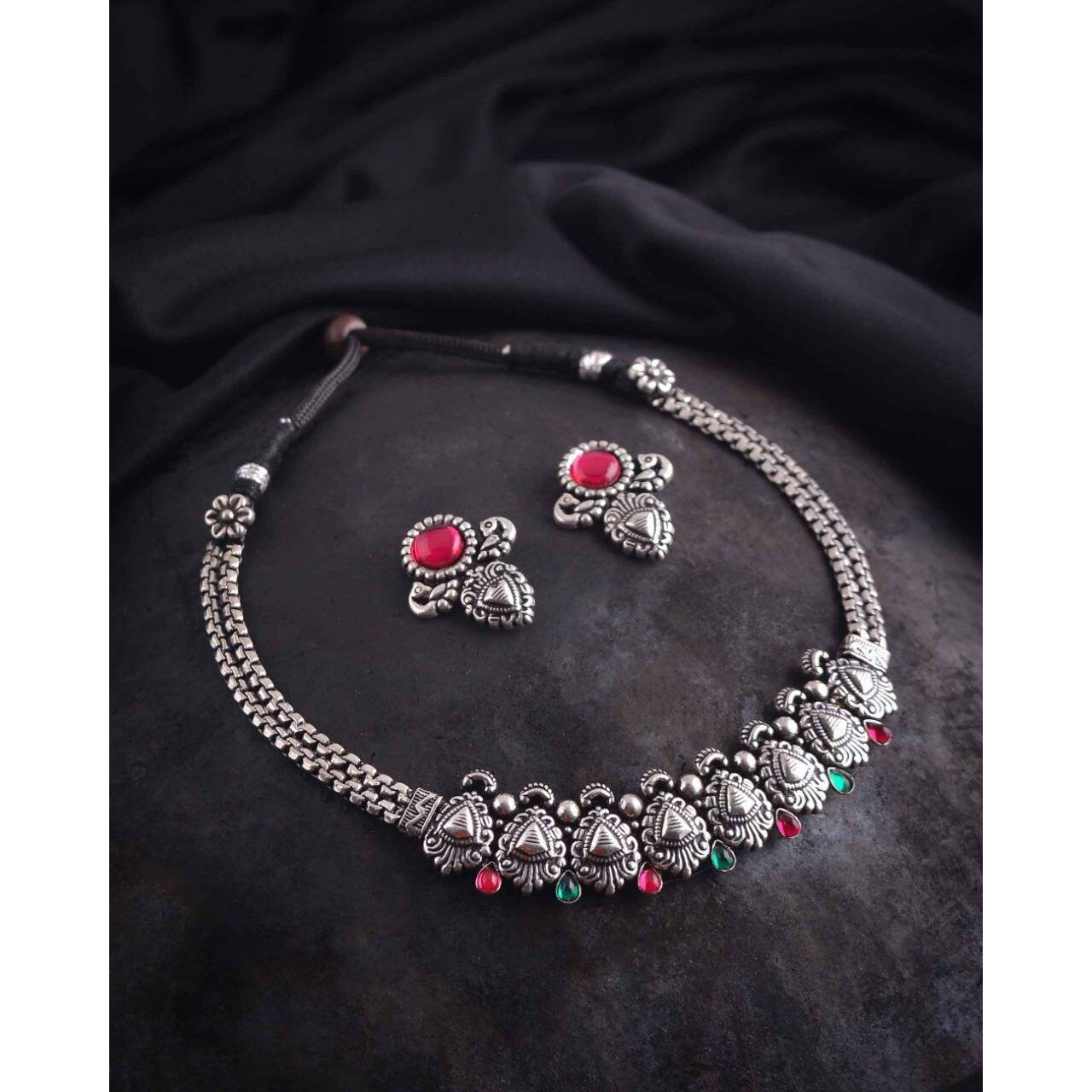 This beautiful set of 6 has a big long Haram necklace with a choker silver necklace, pair of stud earrings, a ring,a Kada , and a nose pin.Grab this beautiful set with any of the ethnic/ Indo western outfit and look unique in the crowdPremium quality set