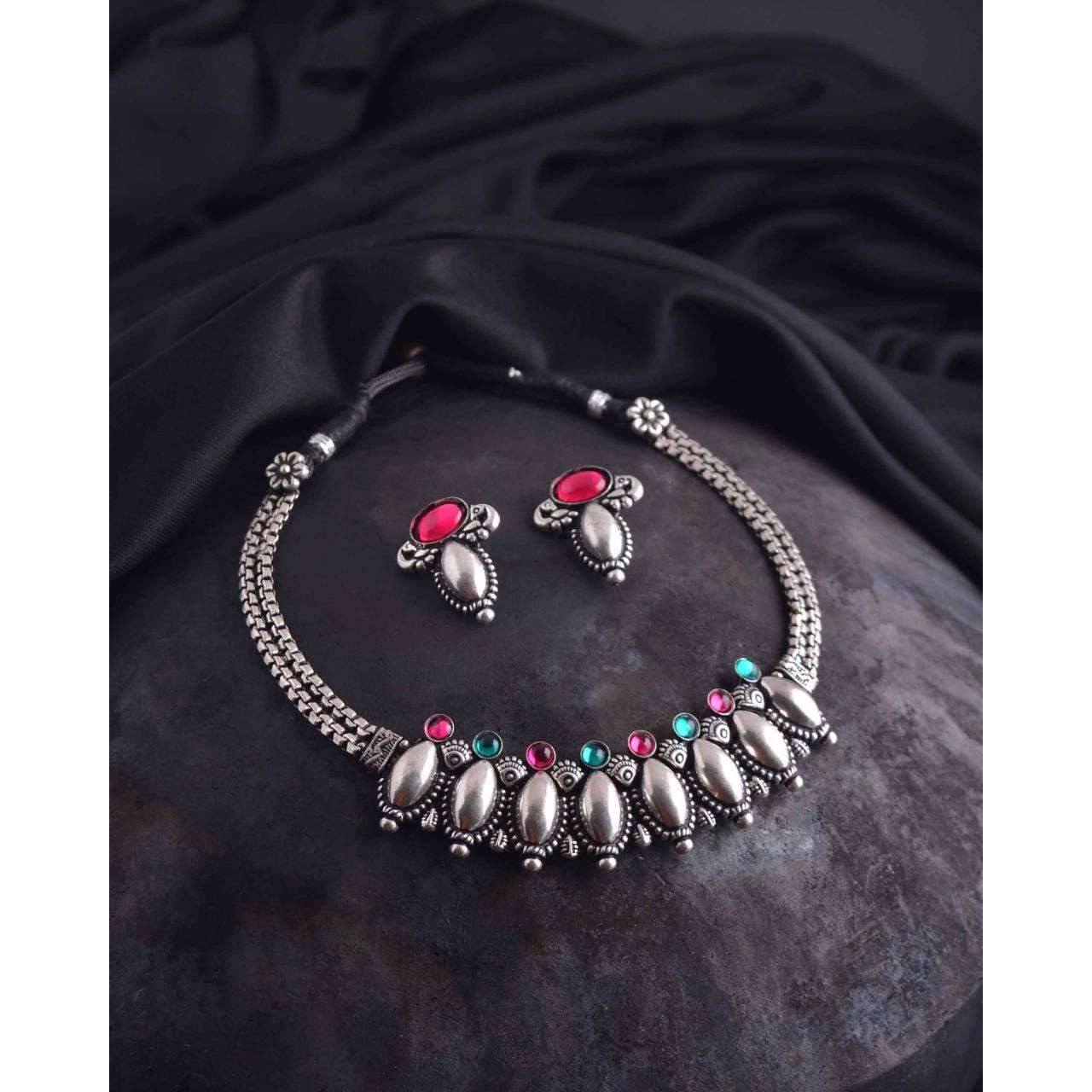 This beautiful set of 6 has a big long Haram necklace with a choker silver necklace, pair of stud earrings, a ring,a Kada , and a nose pin.Grab this beautiful set with any of the ethnic/ Indo western outfit and look unique in the crowdPremium quality set