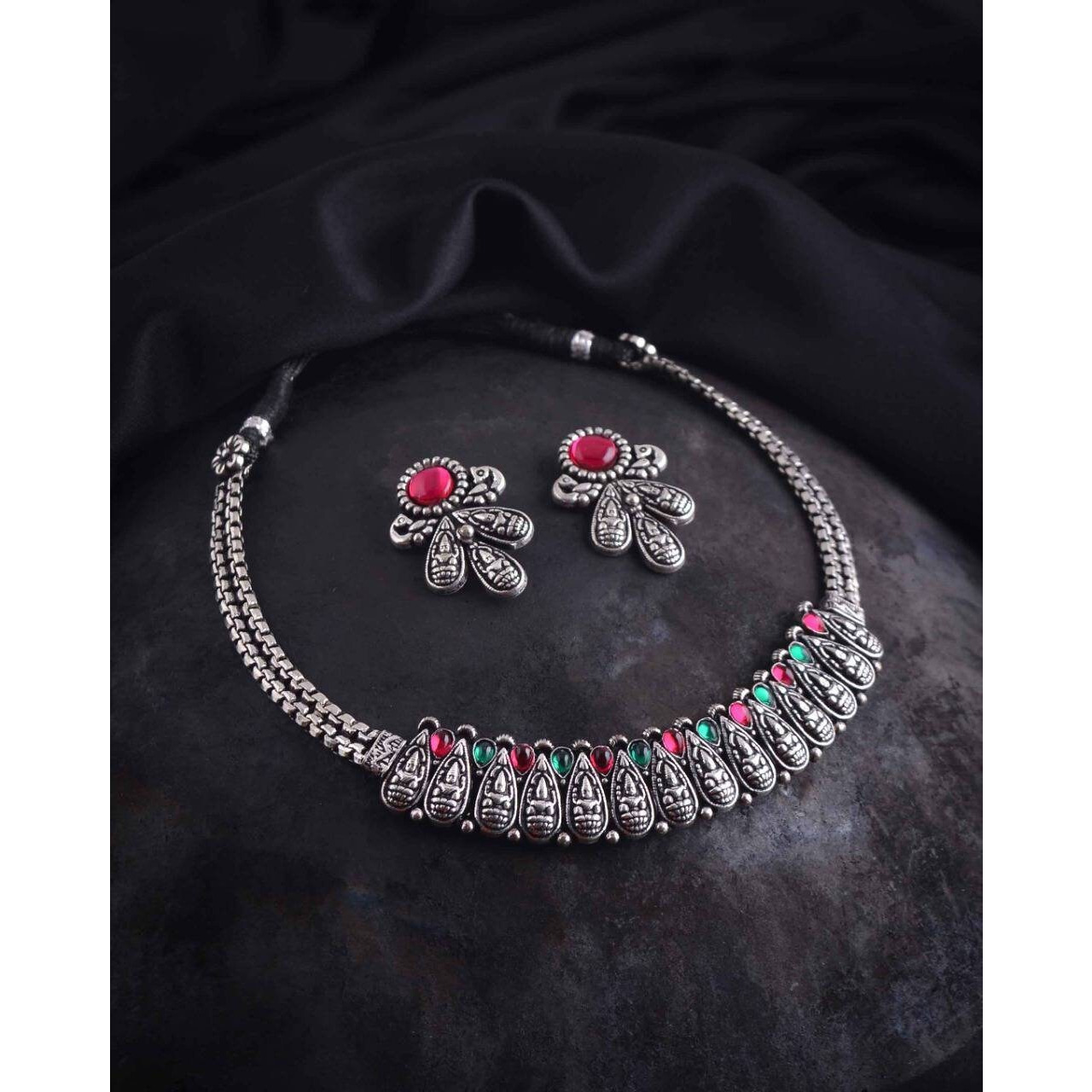 This beautiful set of 6 has a big long Haram necklace with a choker silver necklace, pair of stud earrings, a ring,a Kada , and a nose pin.Grab this beautiful set with any of the ethnic/ Indo western outfit and look unique in the crowdPremium quality set