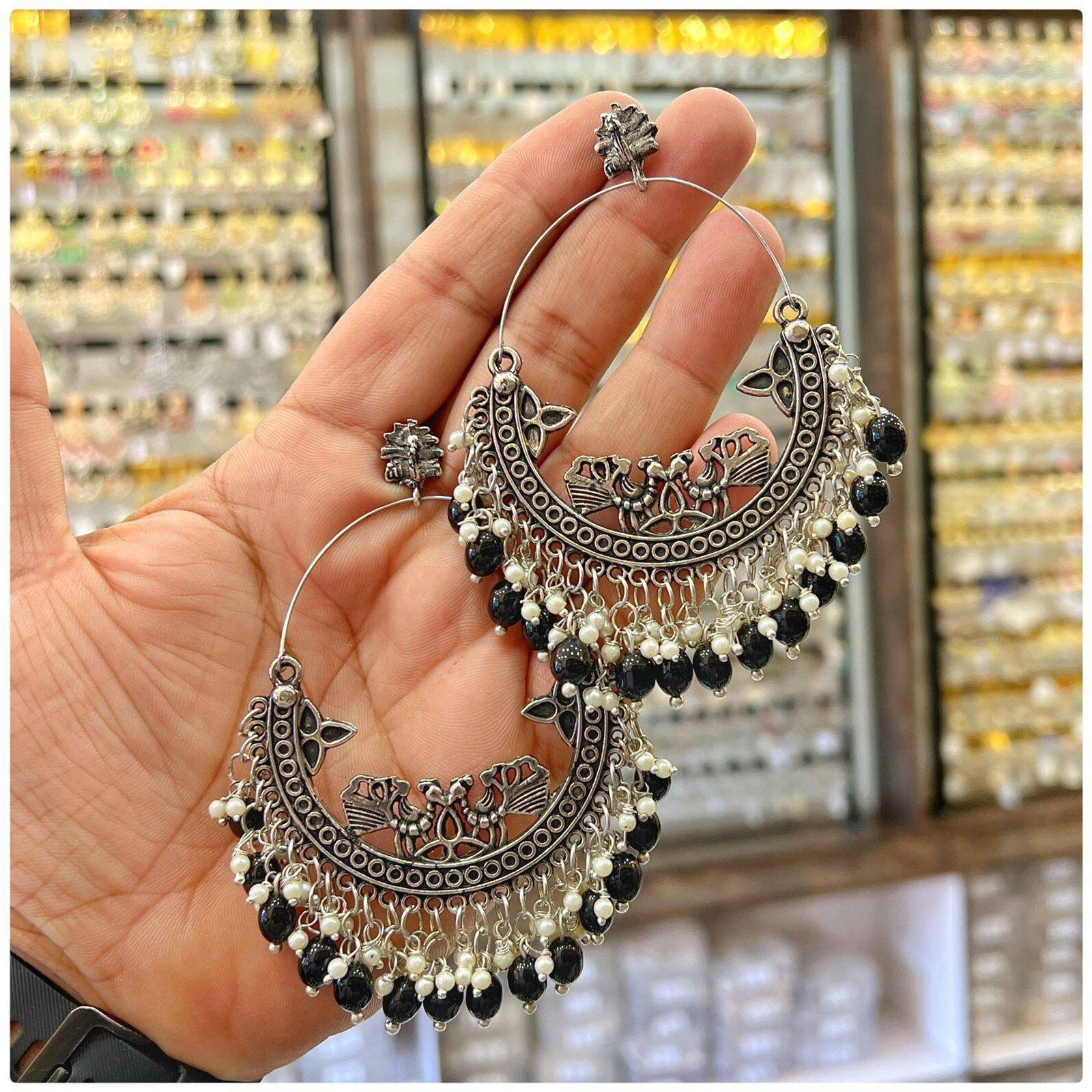 Long handmade earrings can really add an extra dimension to your entire look. This pair of beautiful oxidized silver earrings can be a wonderful gift idea for your loved ones. Pair it with a matching necklace, and you have a perfect ethnic, chic look. These seed bead earrings are amazing pieces of wedding jewelry. If you want lightweight bridal jewelry that doesn't weigh your face down, then this pair of earrings can be an excellent choice. Store them in a cool and dry place to preserve the item