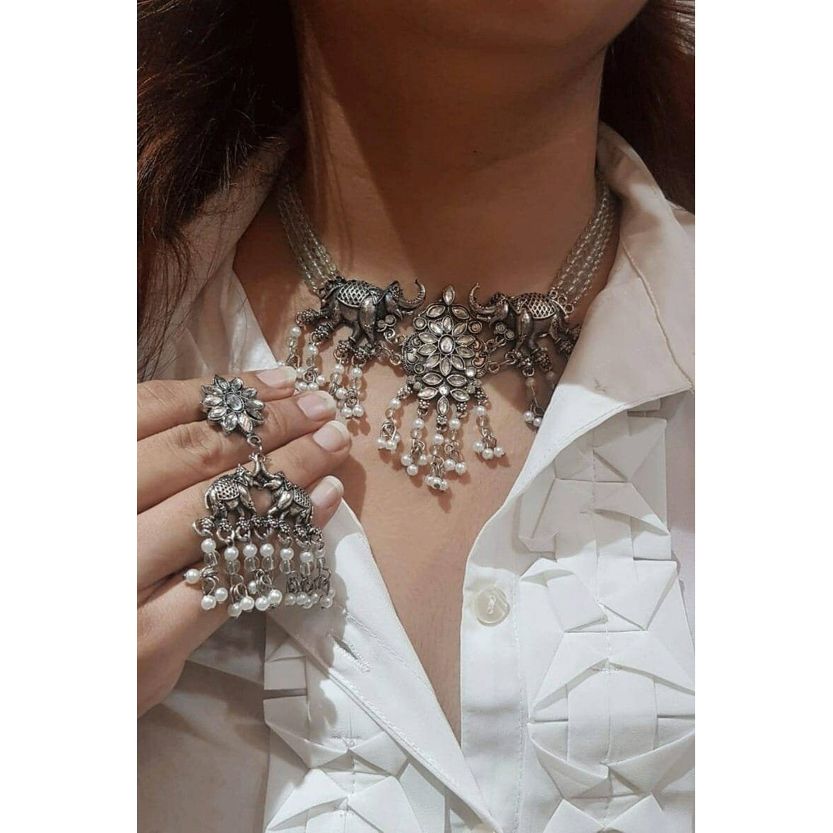Adorn your beautiful personality with this exquisitely designed and handcrafted necklace in high-quality German silver. Pair it up with any casual, semi-formal, or formal attire for that traditional yet contemporary look. Stylish and trendy handcrafted jewelry from Vastra Bhushan will definitely go noticed and complete your contemporary or Indian look. All our products are made with the utmost care and pass a quality check of global standards and hence, we guarantee 100% authenticity. Use soft