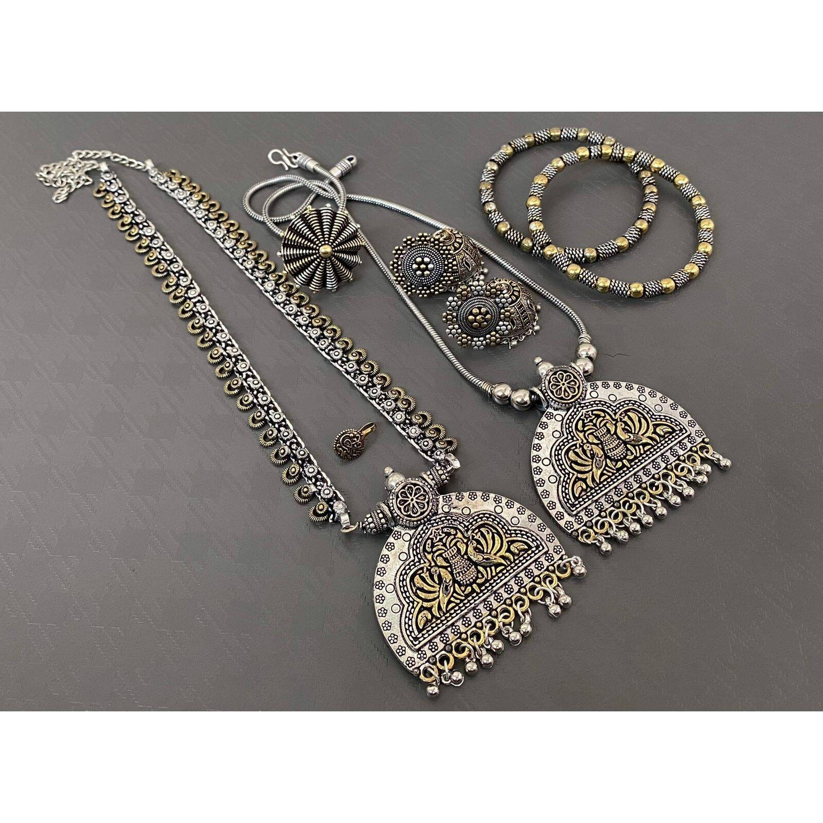 Haathphools have made a comeback, and what a comeback it is This piece of oxidizedsilver jewelry combines a bracelet and a ring, which are joined by arty links. The haathphools are generally seen on brides and are very occasion specific. However, a subduedoxidized white rhodium-plated version like this is a great way to wear it as Indianjewelry outside of weddings and not just for the bride. The rhodium plating is long-lasting,making it superior to traditional Indian silver jewelry. So, what ar