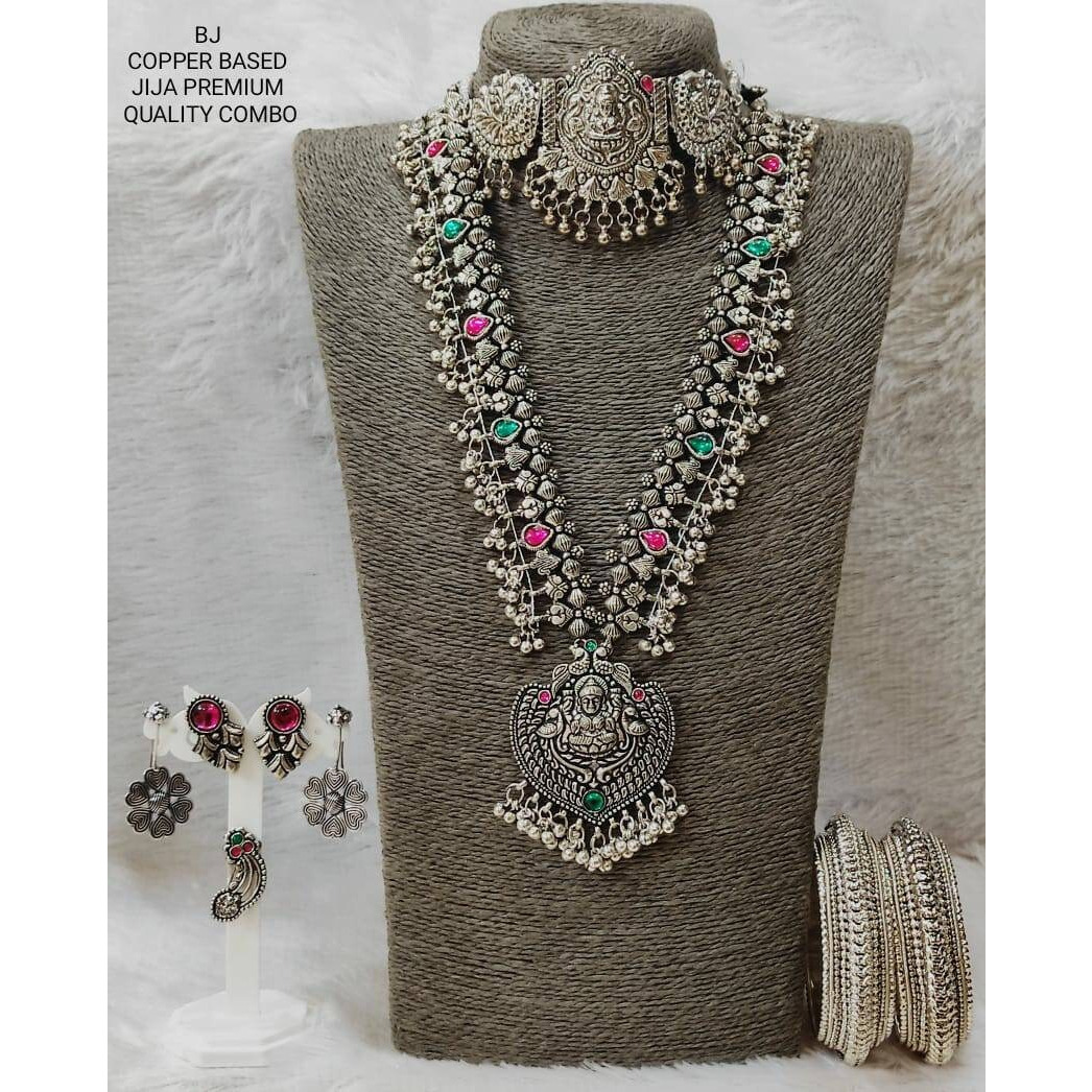 Adorn your wrists with a beautiful chime. This bracelet adds a perfect amount of pretty you would like to add to your ethnic outfits. This bracelet kada is crafted in German silver and shiny bells that create a melody of charm and beauty. An accessory that will complete your look with minimum effort and maximum style quotient This Silver Oxidised Bangle kada boasts beautiful Maa Durga motifs that will always keep you rooted in Indian History. Crafted in oxidized silver and playful ghungaroos, t