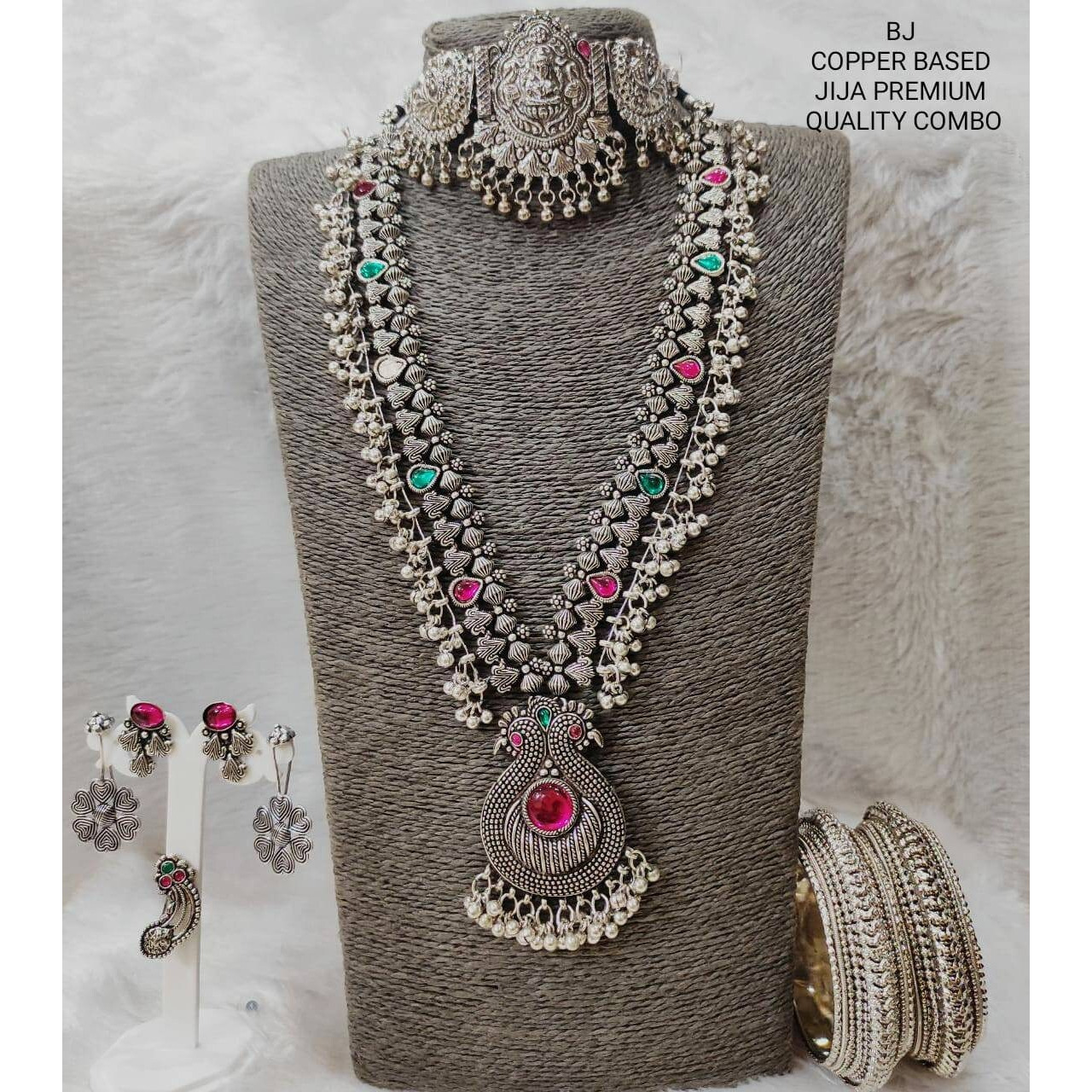 Adorn your wrists with a beautiful chime. This bracelet adds a perfect amount of pretty you would like to add to your ethnic outfits. This bracelet kada is crafted in German silver and shiny bells that create a melody of charm and beauty. An accessory that will complete your look with minimum effort and maximum style quotient This Silver Oxidised Bangle kada boasts beautiful Maa Durga motifs that will always keep you rooted in Indian History. Crafted in oxidized silver and playful ghungaroos, t