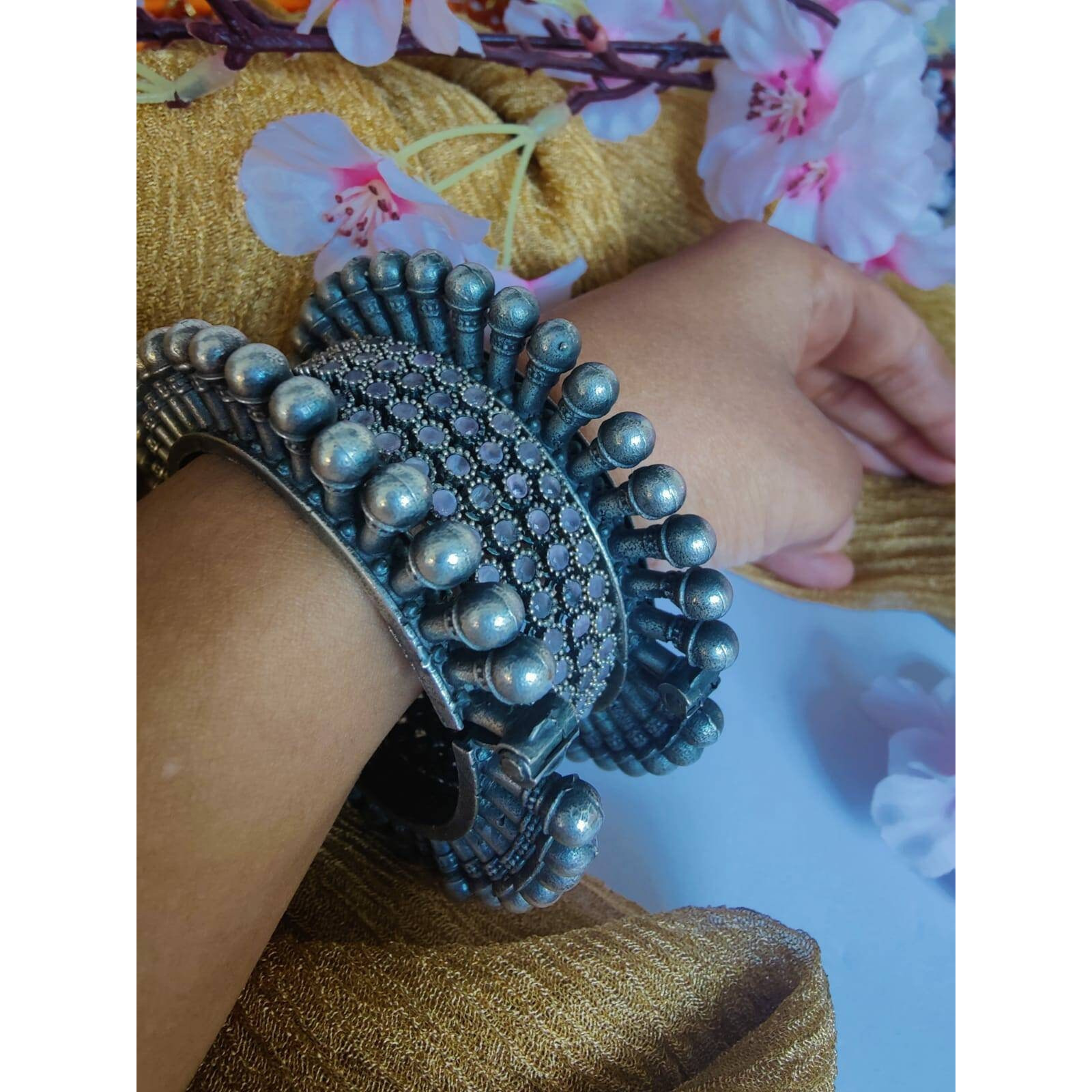 Women Silver Oxidised peacock feather Kada Bangle for Women. The Perfect Gift  Ideal for the Woman who loves products that are Handmade In India and artisinal. All occassion jewelery for through out the year from Valentines Day ,a Special Birthday or an Anniversary gift for your special one. 100% Genuine Quality Product. 100% Handmade in India with Love.Usage Avoid contact with water and organic chemicals i.e. perfume sprays. Avoid using velvet boxes, and store in air-tight boxes. After use, w