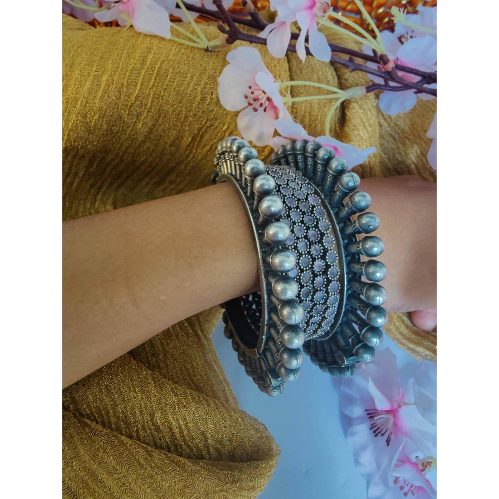 Women Silver Oxidised peacock feather Kada Bangle for Women. The Perfect Gift  Ideal for the Woman who loves products that are Handmade In India and artisinal. All occassion jewelery for through out the year from Valentines Day ,a Special Birthday or an Anniversary gift for your special one. 100% Genuine Quality Product. 100% Handmade in India with Love.Usage Avoid contact with water and organic chemicals i.e. perfume sprays. Avoid using velvet boxes, and store in air-tight boxes. After use, w
