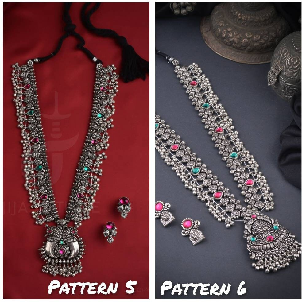Steal the show with our Indian oxidized German silver long double necklace full combo set.It is a set of 6 beautifully designed pieces of jewellery, having a big long Haram oxidizednecklace, choker silver necklace, a pair of jhumka earrings, ring, a pair of bangles, and nosepin, hand-made with German oxidized silver to give it a dignified look. Style this with yourfavourite ethnics or Indo-western outfits, and you are ready for Navratri This hand-madeKolhapuri boho necklace set may have slight