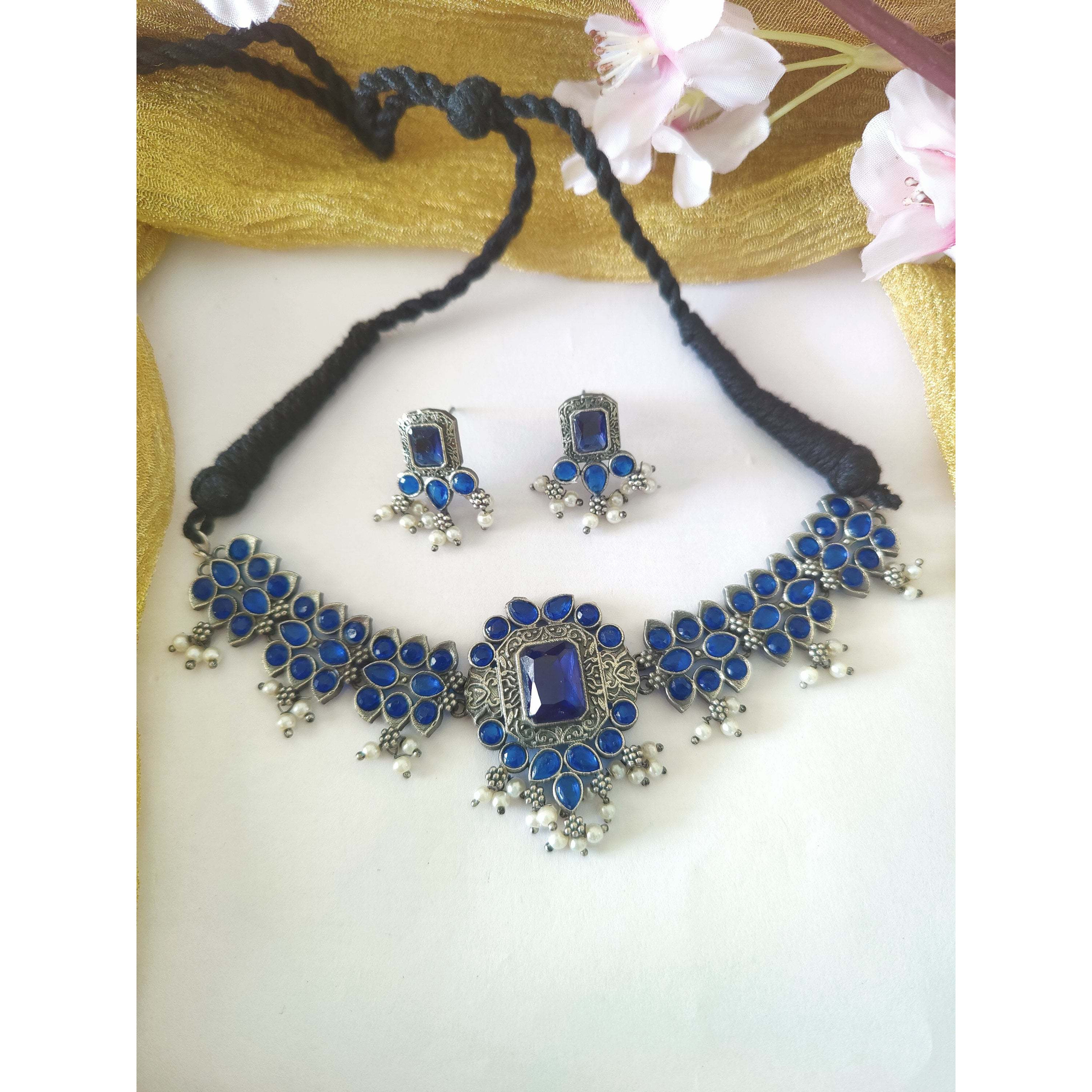 A vintage pair of afghan earring jewelry that will awaken the jewelry lover in you with its vivid & colorful glass work and bold aesthetics. Our Afghani Earrings will give you all the bohemian vibes. They are summery and beautiful, this dangler is oh-so-perfect for every woman. These are handcrafted danglers that are made with German silver. This piece will compliment almost everything in your closet.