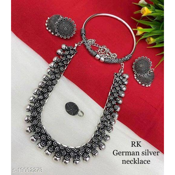 Featuring a pair of antique silver finish dangler earrings with beautiful crescent & floral motifs crafted in oxidized german silver and embellished with handcut raw mirror. This elaborate pair of earrings brimming with shiny mirror details , contrasting with the raw metal texture around it adds to its elegance. A contemporary piece that you'd want to slip into, for all your indo-western looks.Note - The product is handmade and the mirrors are cut and pasted by hand, hence there might be certain