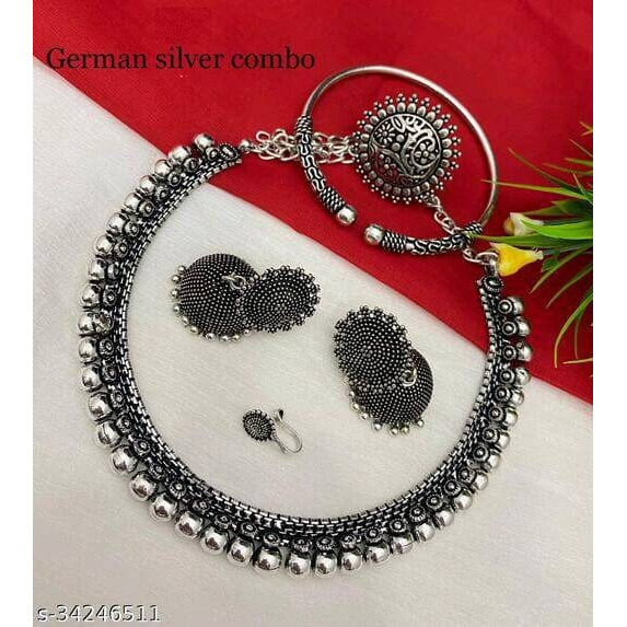 Featuring a pair of antique silver finish dangler earrings with beautiful crescent & floral motifs crafted in oxidized german silver and embellished with handcut raw mirror. This elaborate pair of earrings brimming with shiny mirror details , contrasting with the raw metal texture around it adds to its elegance. A contemporary piece that you'd want to slip into, for all your indo-western looks.Note - The product is handmade and the mirrors are cut and pasted by hand, hence there might be certain