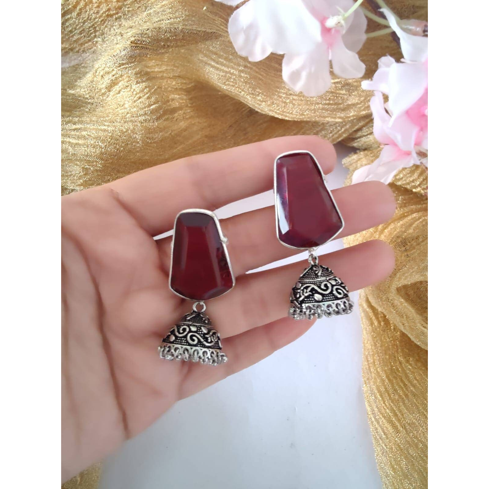 A vintage pair of afghan jewelry that will awaken the jewelry lover in you with its vivid & colorful glass mirror work and bold aesthetics. Our Afghani Earrings will give you all the bohemian vibes. They are summery and beautiful, this dangler is oh-so-perfect for every woman. These are handcrafted danglers that are made with German silver. This piece will compliment almost everything in your closet.