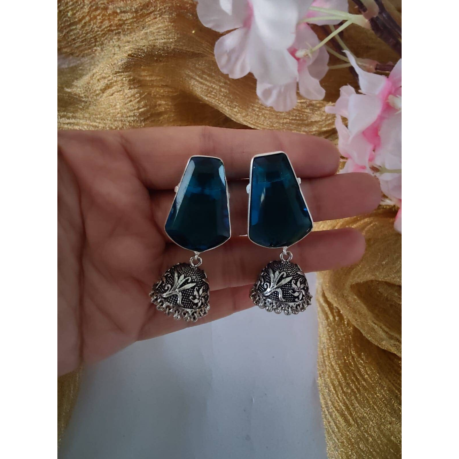 A vintage pair of afghan jewelry that will awaken the jewelry lover in you with its vivid & colorful glass mirror work and bold aesthetics. Our Afghani Earrings will give you all the bohemian vibes. They are summery and beautiful, this dangler is oh-so-perfect for every woman. These are handcrafted danglers that are made with German silver. This piece will compliment almost everything in your closet.