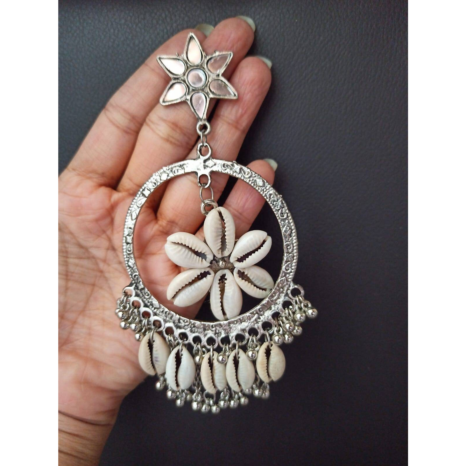A piece of handmade boho jewellery never fails to amplify a woman's beauty and socialconfidence. Thismulticolour bib choker necklaceis made with the finest materials and hashigh-quality silver plating to ensure a long-lasting product life. If you wish to style it everynow and then, we advise you to clean the jewellery with a cotton cloth and store it in an air-tight container away from any chemicals or water. Thisboho tribal necklaceis made ofglass, perfect to fit in the collecti
