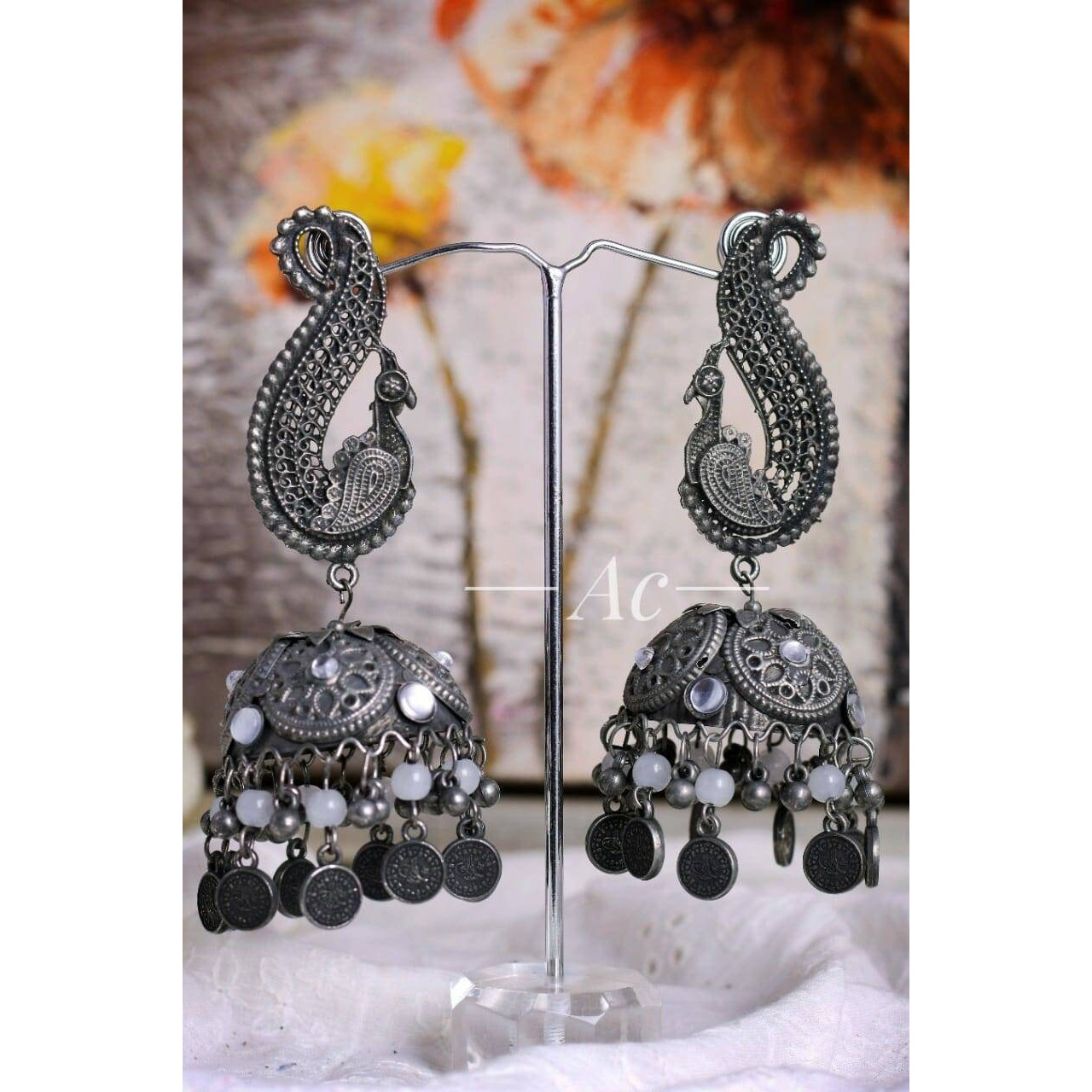 Grab this beautiful round oxidized Jhumka Earring with hanging and pair it with any of the outfit and get the overall elegant look