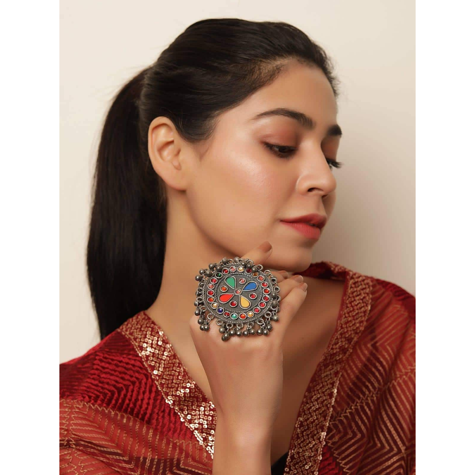 Your favorite set of oxidized earrings will always be this stunning pair. Be it Indian, western, or Indo-western, the lotus-inspired jhumki earrings give a touch of elegance to any look. When it comes to gifting Indian jewelry at important events like weddings, anniversaries, and engagements, these earrings are your best bet. Make a statement with these Indian earrings handcrafted with Indian artistry from Vastrabushan for timely delivery. To maintain the longevity of oxidized jewelry, always ke