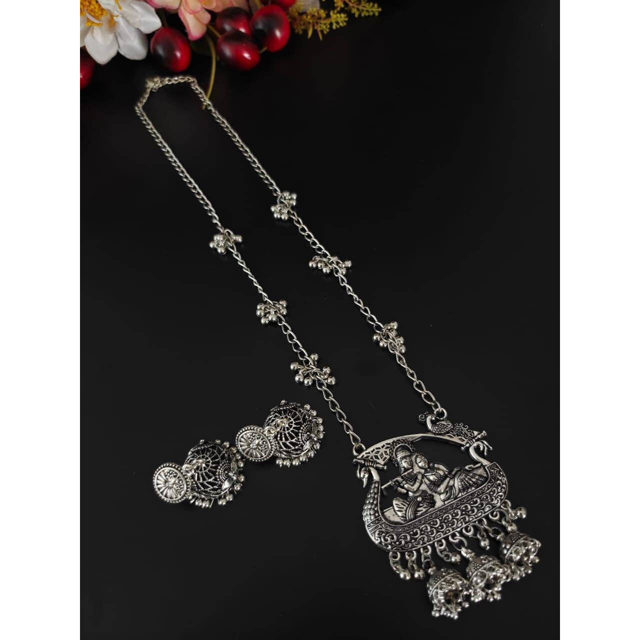 Are you ready to add collar necklaces to your wardrobe This choker set is a lightweight as well as a statement piece that you can't resist. There are beautiful enamels on the pendant along with ghungroos on the sides of the necklace which gives you a Bold and Beautiful look. These exuberant pieces create a sense of individual beauty. These pieces go well with crop tops and long skirts.