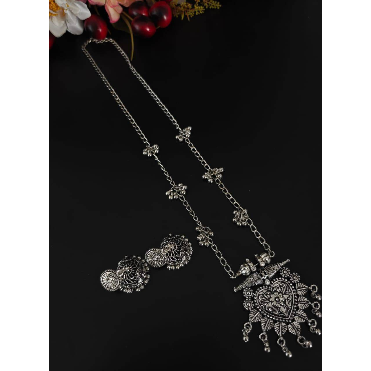 Are you ready to add collar necklaces to your wardrobe This choker set is a lightweight as well as a statement piece that you can't resist. There are beautiful enamels on the pendant along with ghungroos on the sides of the necklace which gives you a Bold and Beautiful look. These exuberant pieces create a sense of individual beauty. These pieces go well with crop tops and long skirts.