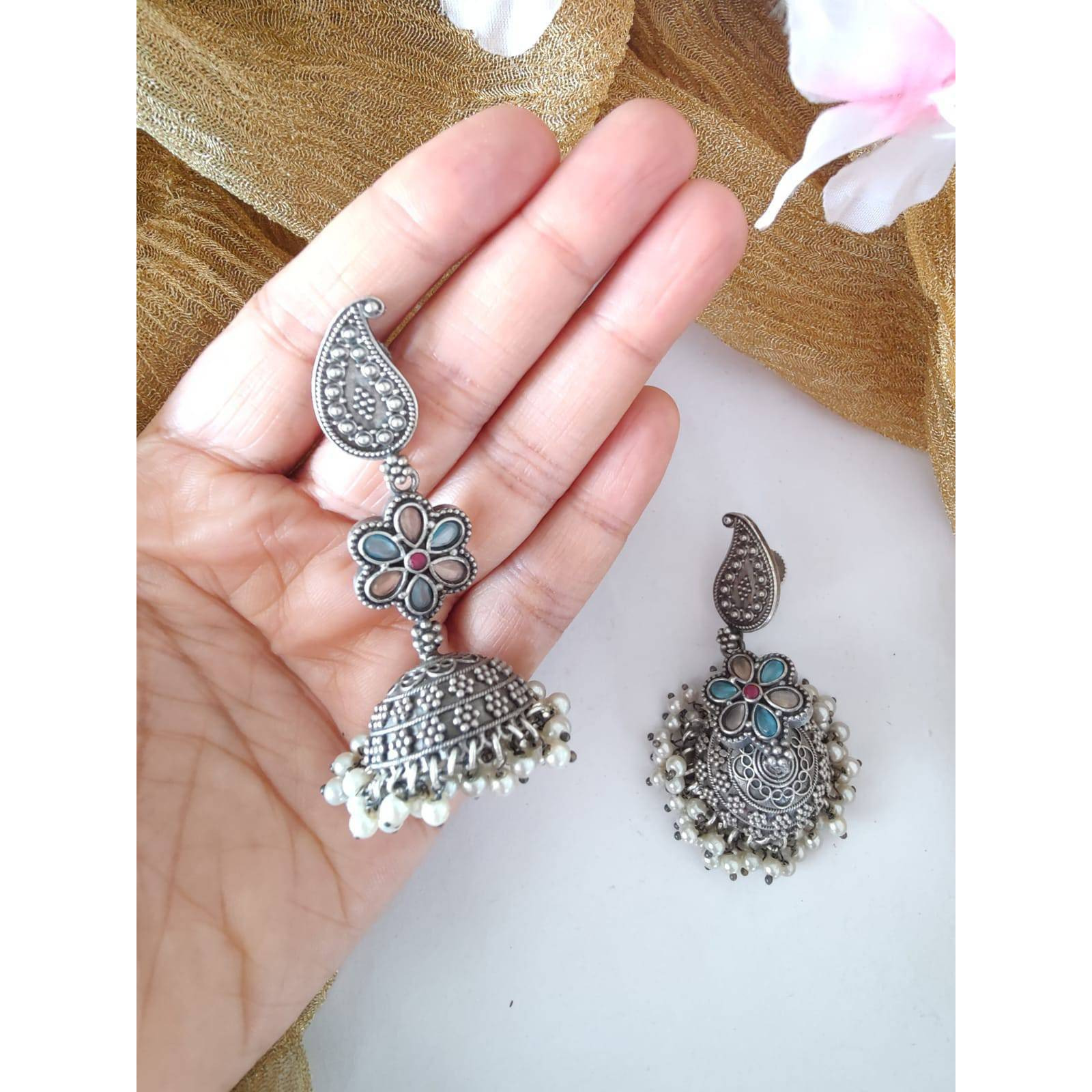 Pick any 7 for 15. Please mention the pattern number of the nosepins you like.Nose pins are an integral part of Indian Tradition and adorned by all women. These pins add an instant ethnic touch to your look and reflect your personality. This nose pin features floral motifs that further add to the beauty of it. Style this with your ethnics or even your casuals and you are good to go
