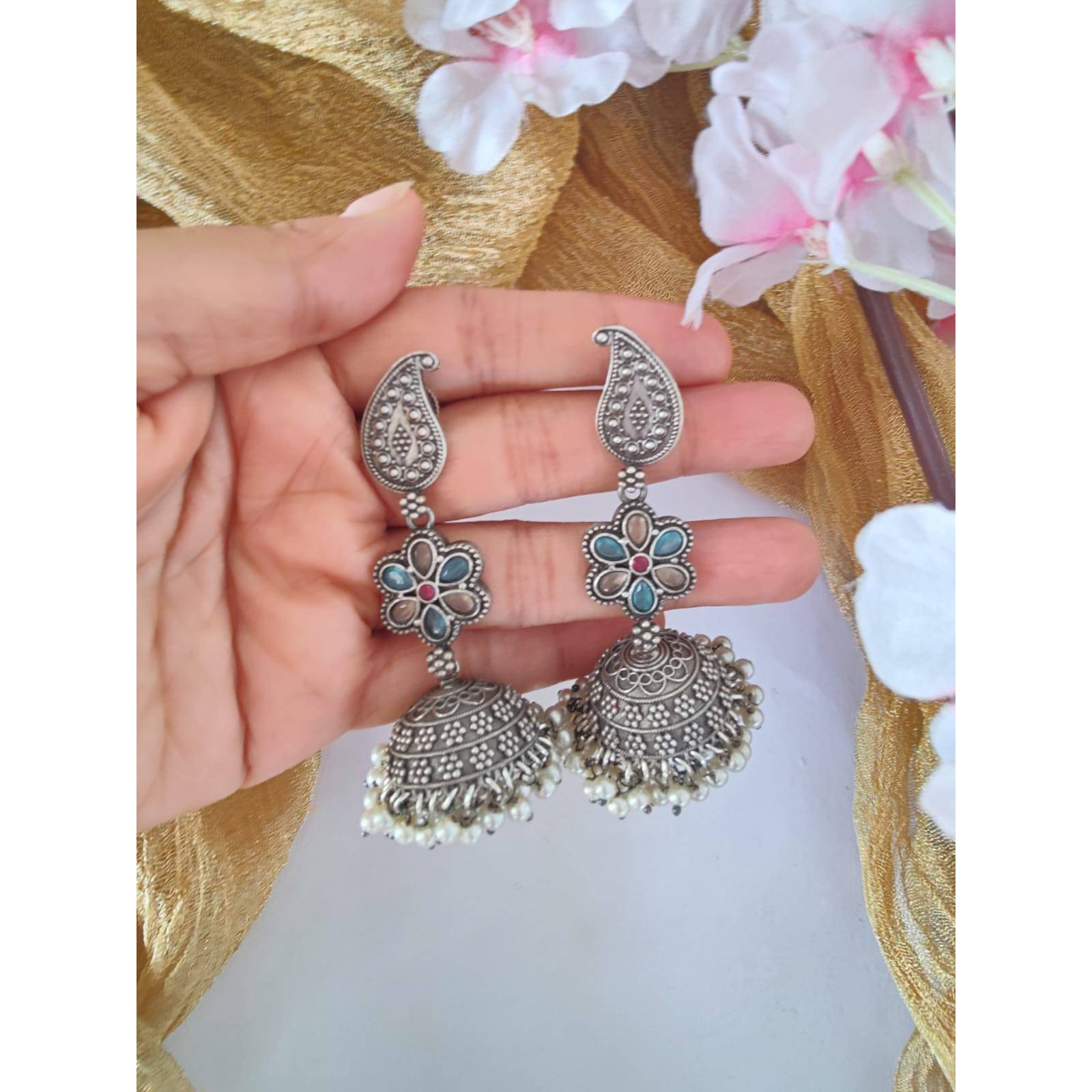 Pick any 7 for 15. Please mention the pattern number of the nosepins you like.Nose pins are an integral part of Indian Tradition and adorned by all women. These pins add an instant ethnic touch to your look and reflect your personality. This nose pin features floral motifs that further add to the beauty of it. Style this with your ethnics or even your casuals and you are good to go