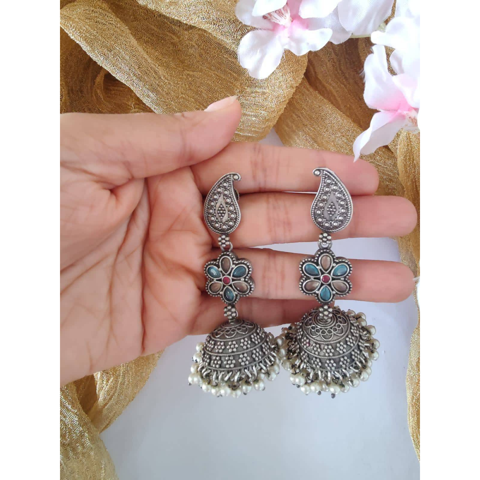 Pick any 7 for 15. Please mention the pattern number of the nosepins you like.Nose pins are an integral part of Indian Tradition and adorned by all women. These pins add an instant ethnic touch to your look and reflect your personality. This nose pin features floral motifs that further add to the beauty of it. Style this with your ethnics or even your casuals and you are good to go