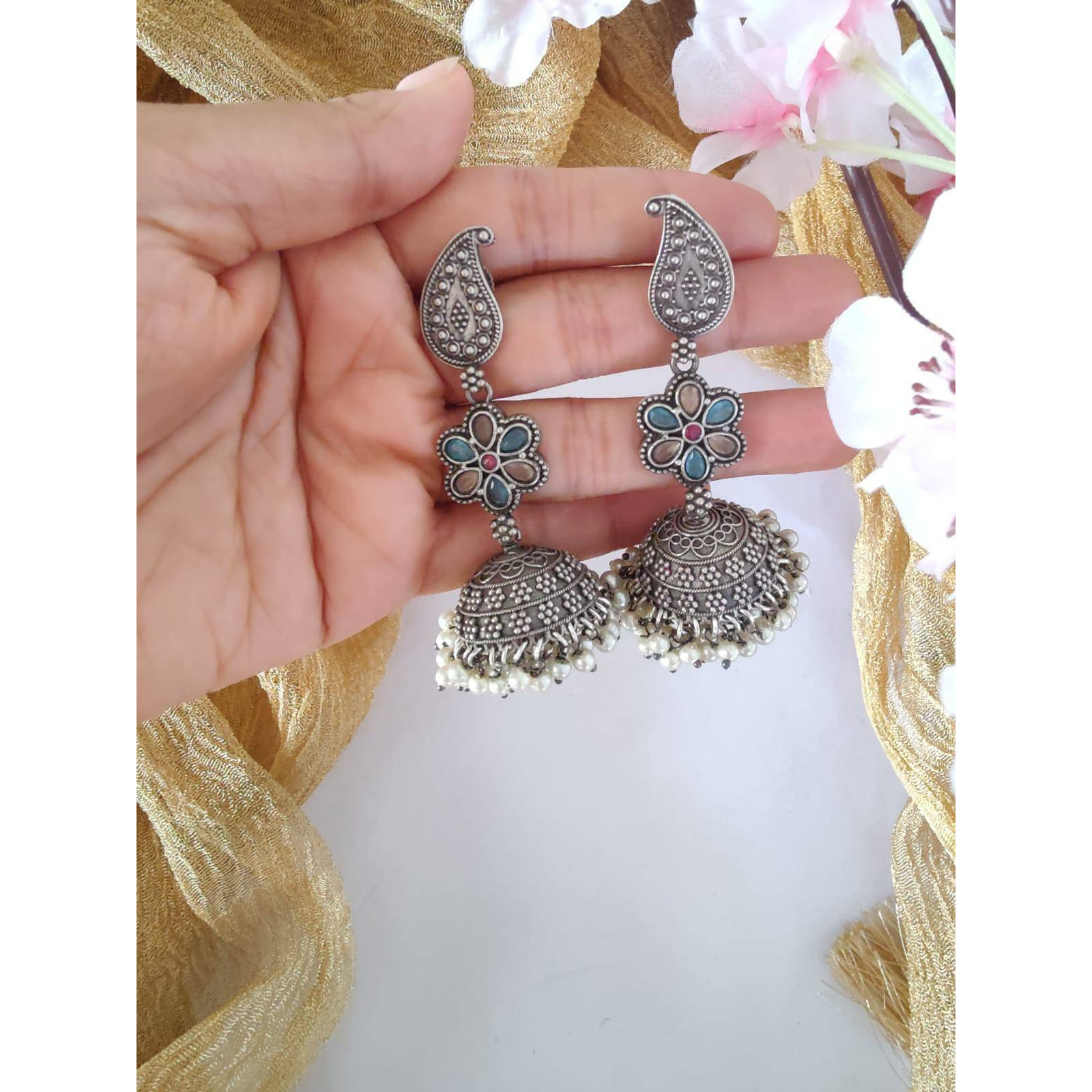Pick any 7 for 15. Please mention the pattern number of the nosepins you like.Nose pins are an integral part of Indian Tradition and adorned by all women. These pins add an instant ethnic touch to your look and reflect your personality. This nose pin features floral motifs that further add to the beauty of it. Style this with your ethnics or even your casuals and you are good to go