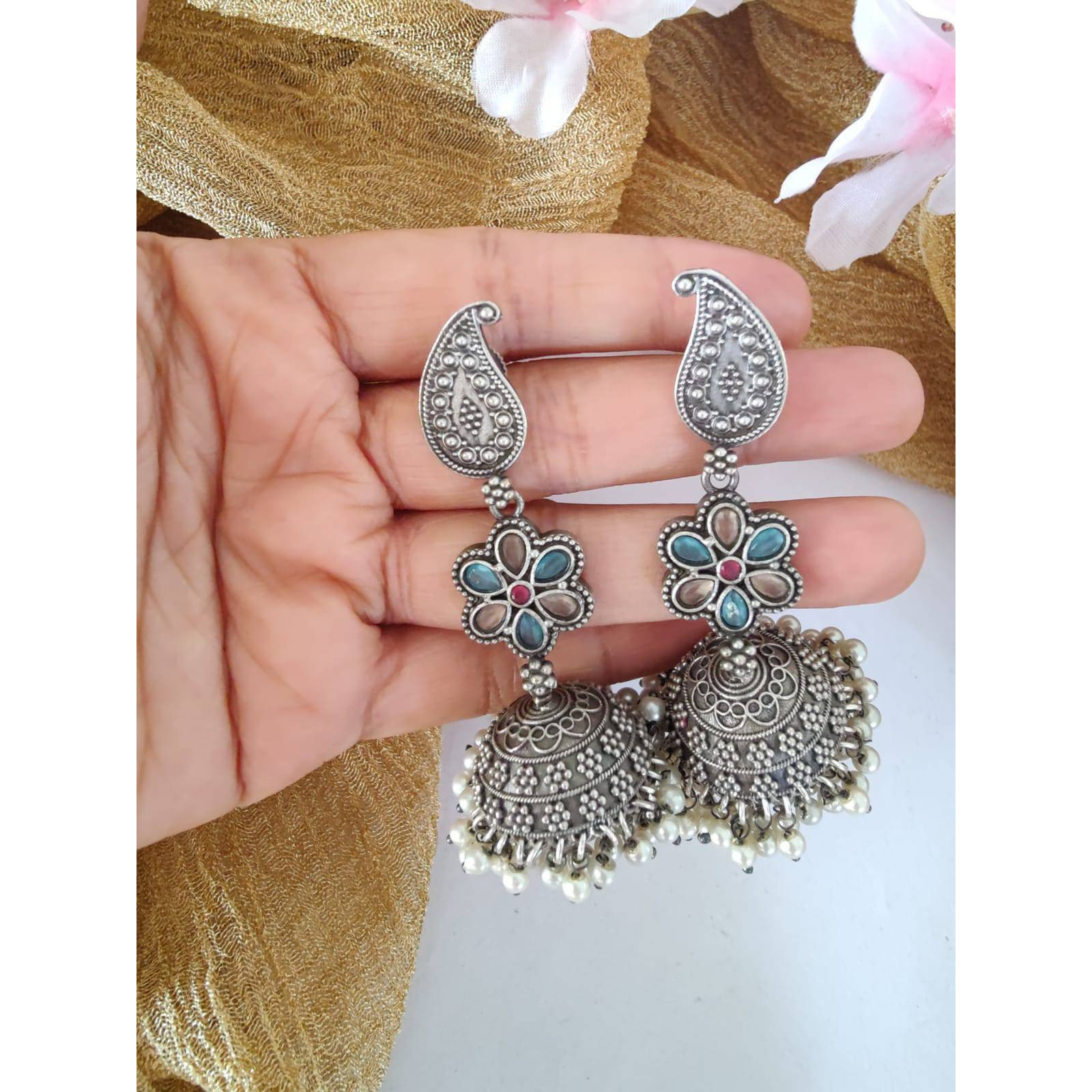 Pick any 7 for 15. Please mention the pattern number of the nosepins you like.Nose pins are an integral part of Indian Tradition and adorned by all women. These pins add an instant ethnic touch to your look and reflect your personality. This nose pin features floral motifs that further add to the beauty of it. Style this with your ethnics or even your casuals and you are good to go