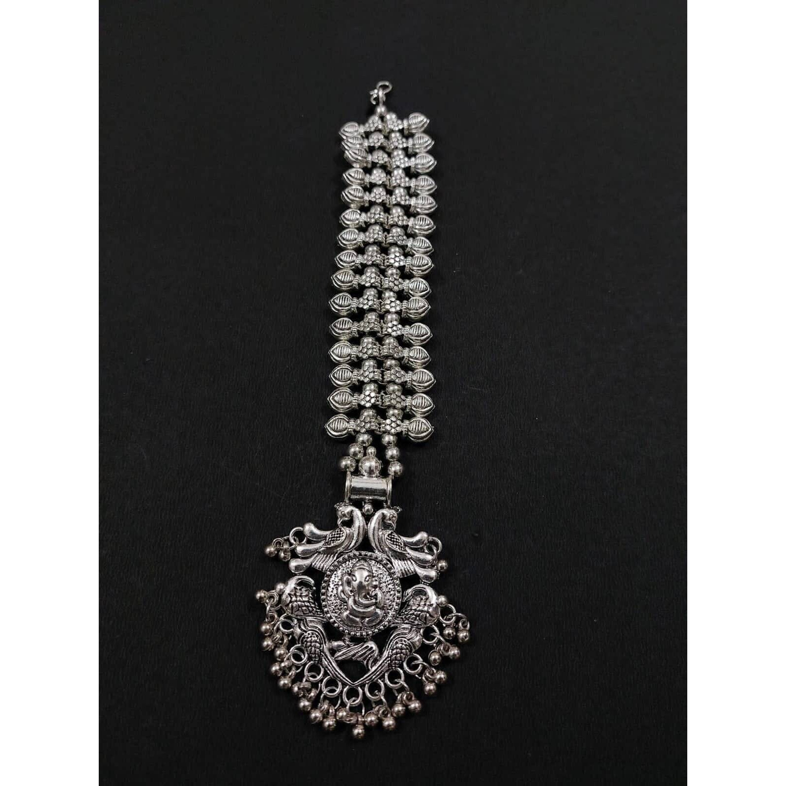 A striking pair of earrings inspired by pearls. Hoops with pearls that add a fun element to the look. These Silver Oxidised Hoop Earrings spell elegant and effortless styling. Style this up with your favorite ethnics or pair them up with your casual outfits for a cheeky look