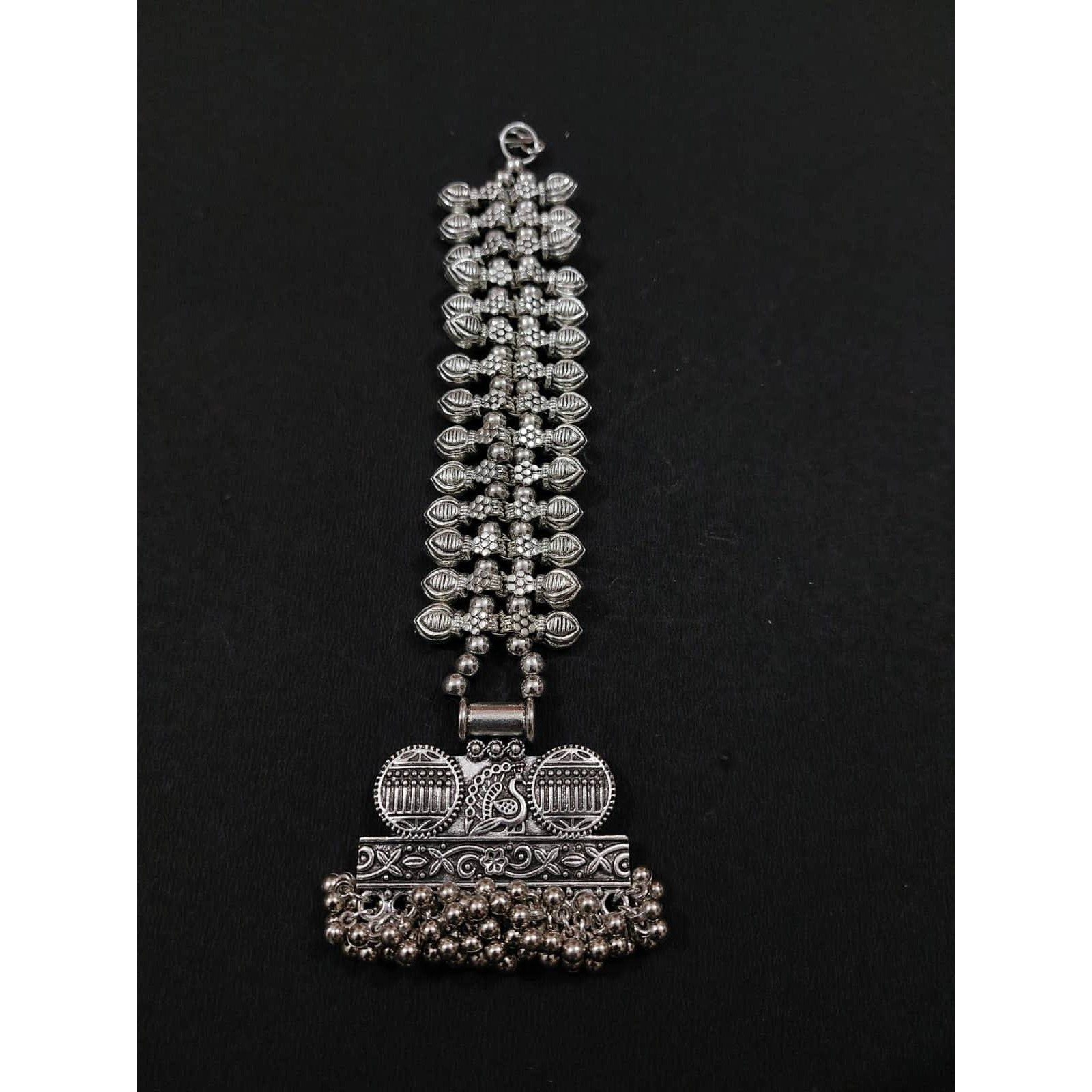 A striking pair of earrings inspired by pearls. Hoops with pearls that add a fun element to the look. These Silver Oxidised Hoop Earrings spell elegant and effortless styling. Style this up with your favorite ethnics or pair them up with your casual outfits for a cheeky look