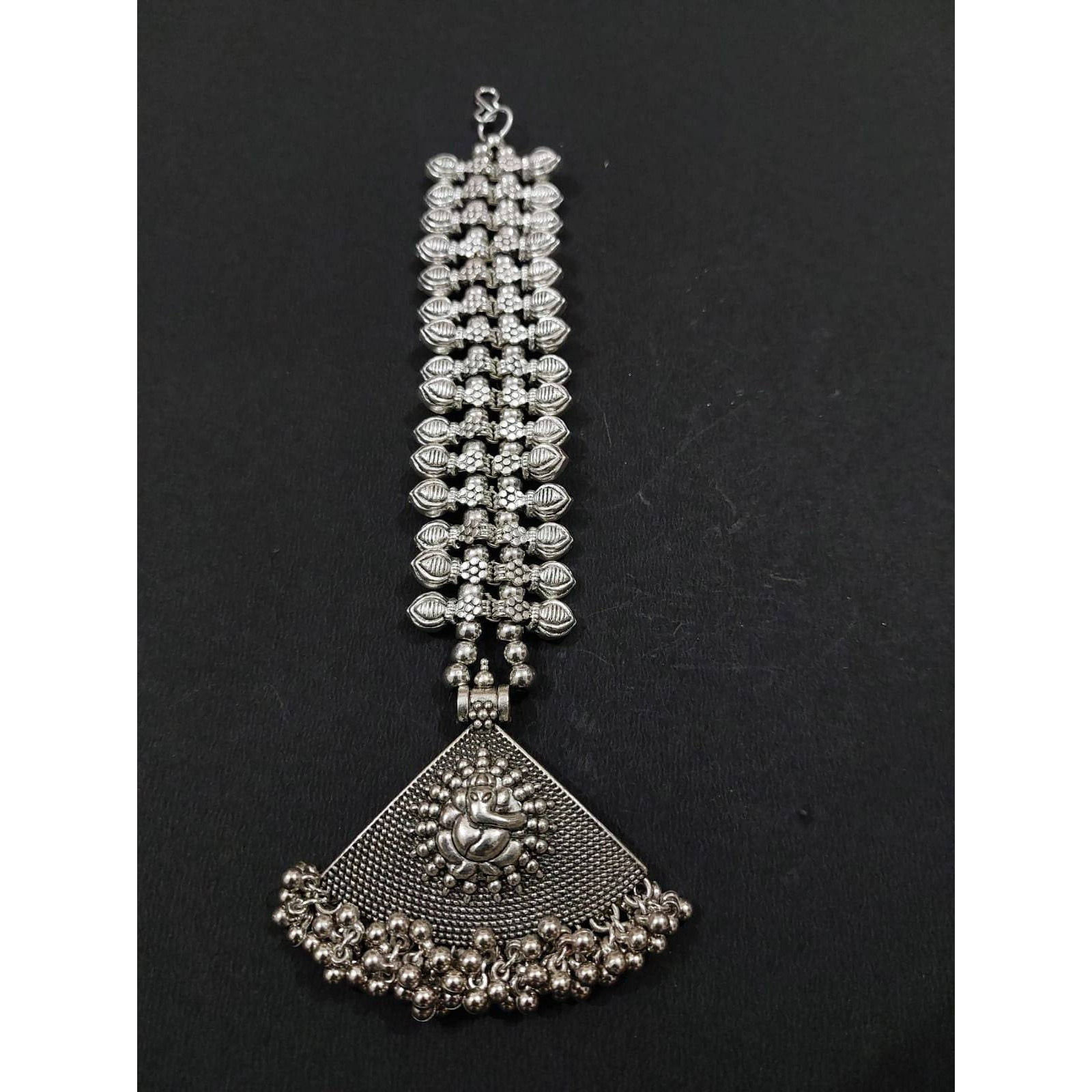 A striking pair of earrings inspired by pearls. Hoops with pearls that add a fun element to the look. These Silver Oxidised Hoop Earrings spell elegant and effortless styling. Style this up with your favorite ethnics or pair them up with your casual outfits for a cheeky look