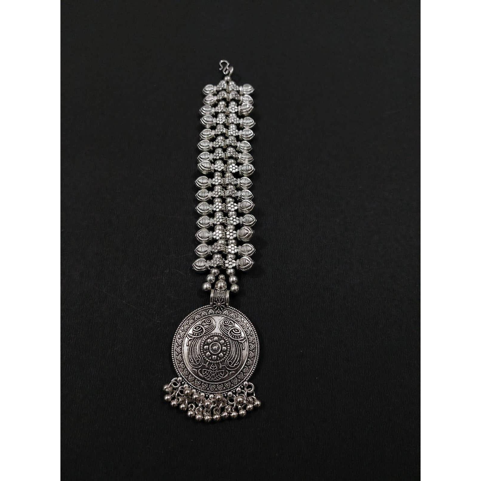 A striking pair of earrings inspired by pearls. Hoops with pearls that add a fun element to the look. These Silver Oxidised Hoop Earrings spell elegant and effortless styling. Style this up with your favorite ethnics or pair them up with your casual outfits for a cheeky look