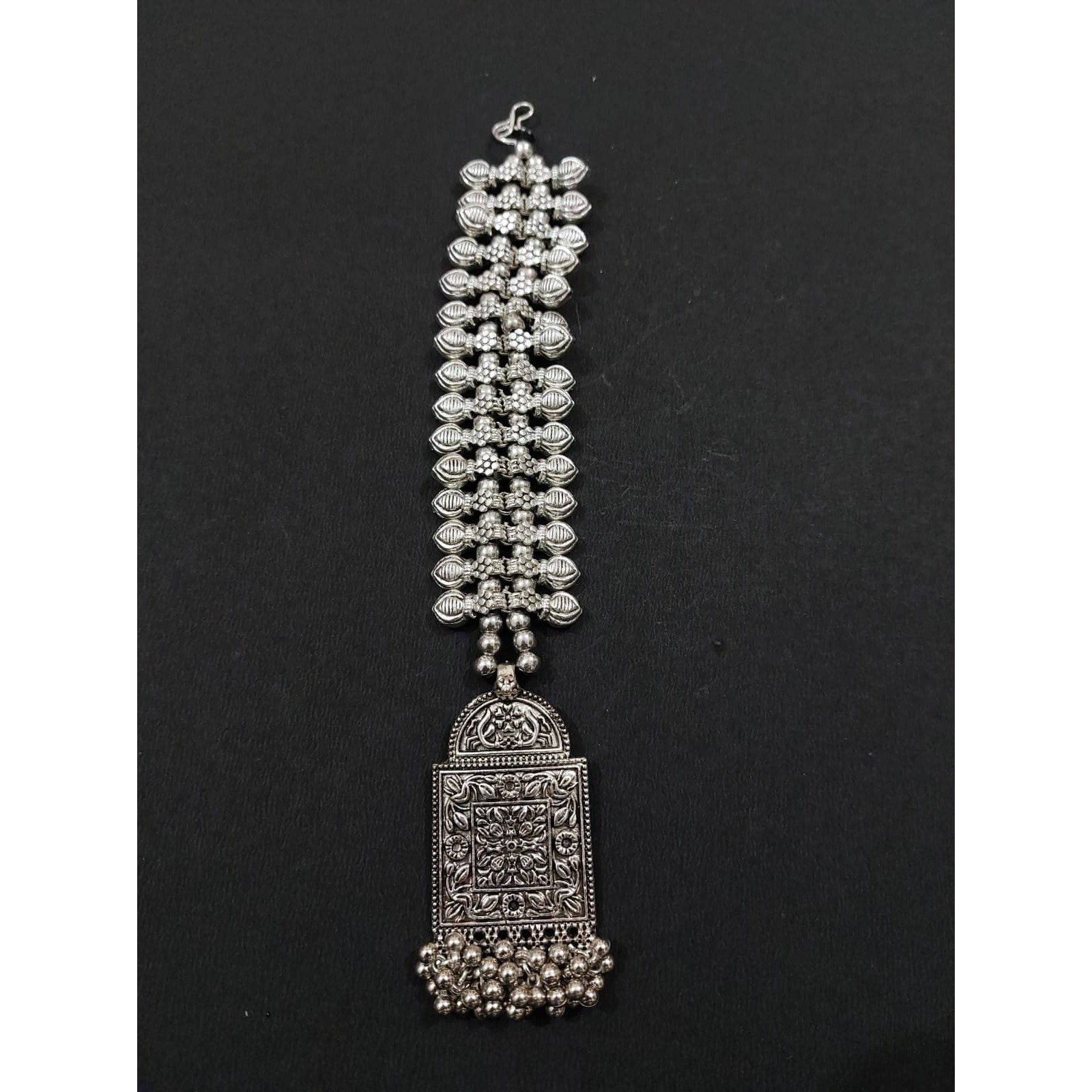 A striking pair of earrings inspired by pearls. Hoops with pearls that add a fun element to the look. These Silver Oxidised Hoop Earrings spell elegant and effortless styling. Style this up with your favorite ethnics or pair them up with your casual outfits for a cheeky look