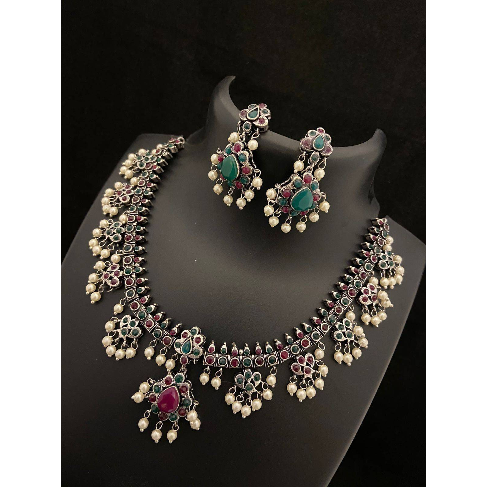 Dramatizing the classy hoops with colorful stones and dreamy pearls Our Peacock Multicolored Hoop Earrings is a classy affair of vintage and contemporary, Crafted in german silver, these earrings accentuate beauty with intricate peacock motifs with multicolored stones and pearls by the edge. A jewelry delight, these earrings will promise to dress you up and add a touch of glam to your look. Stylish and Versatile, these earrings are a must-have