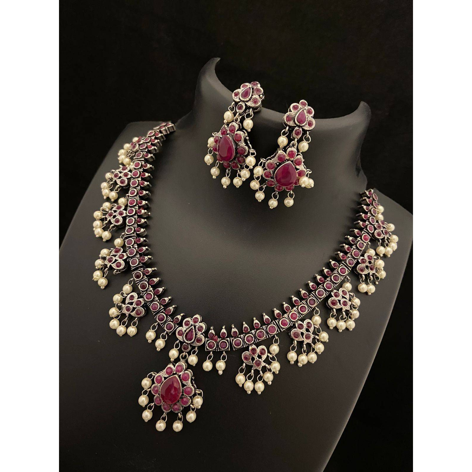 Dramatizing the classy hoops with colorful stones and dreamy pearls Our Peacock Multicolored Hoop Earrings is a classy affair of vintage and contemporary, Crafted in german silver, these earrings accentuate beauty with intricate peacock motifs with multicolored stones and pearls by the edge. A jewelry delight, these earrings will promise to dress you up and add a touch of glam to your look. Stylish and Versatile, these earrings are a must-have