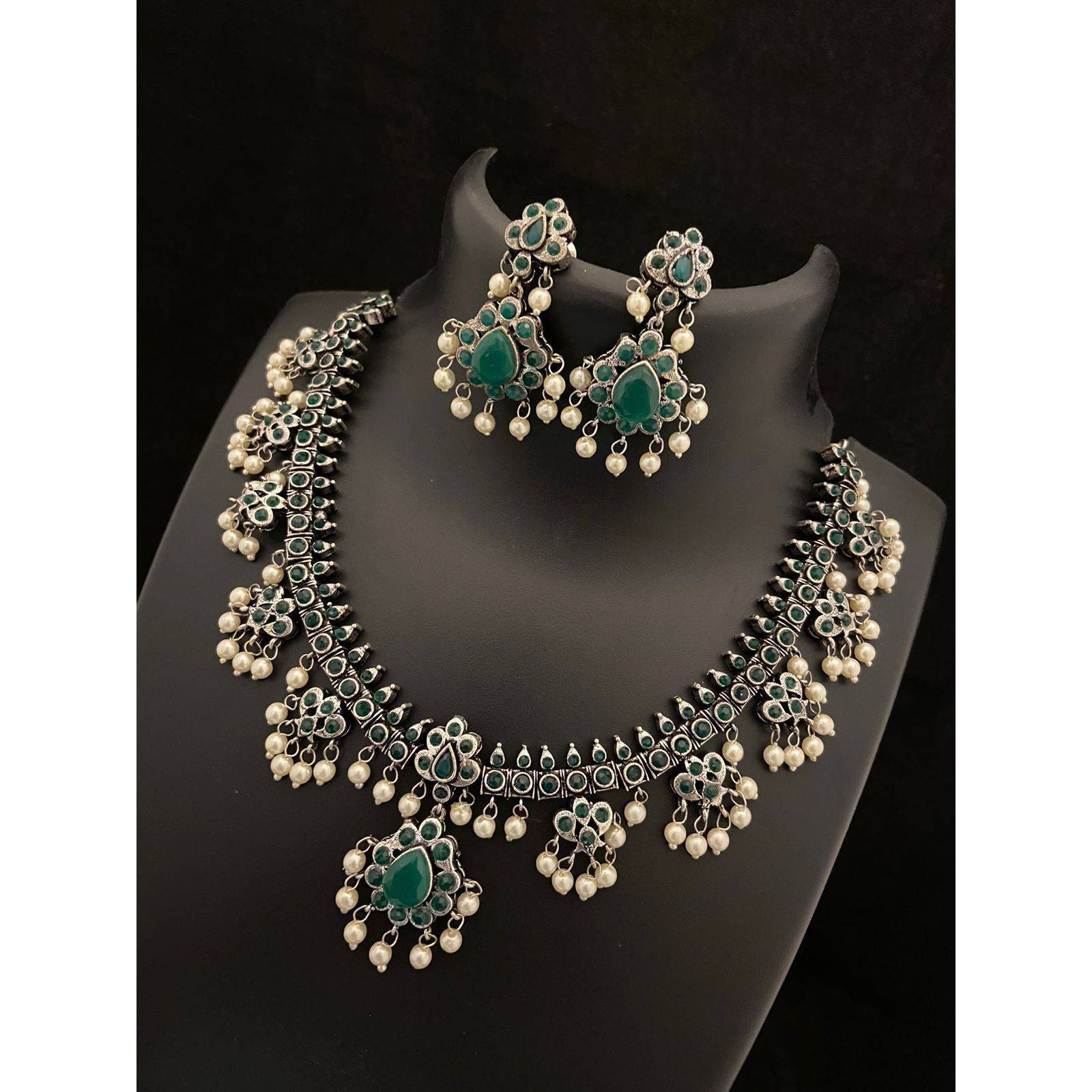 Dramatizing the classy hoops with colorful stones and dreamy pearls Our Peacock Multicolored Hoop Earrings is a classy affair of vintage and contemporary, Crafted in german silver, these earrings accentuate beauty with intricate peacock motifs with multicolored stones and pearls by the edge. A jewelry delight, these earrings will promise to dress you up and add a touch of glam to your look. Stylish and Versatile, these earrings are a must-have